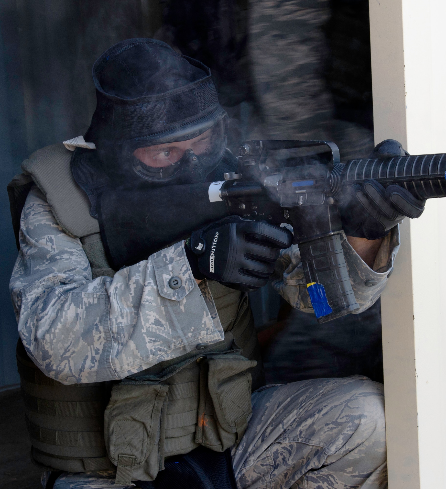 Cadet 1st Class Christopher Moede fires on an enemy position during mobile operations in urban terrain training in Jacks Valley at the Air Force Academy Aug. 13, 2011. Soldiers with Fort Carson's 10th Special Forces Group offered the training, both to familiarize cadets with MOUT tactics and to prepare for an upcoming deployment wherein they will train foreign servicemembers. Moede is the cadet chief of safety for Cadet Squadron 35 and is a member of the Academy's cadet combat shooting team. (U.S. Air Force photo/Don Branum)