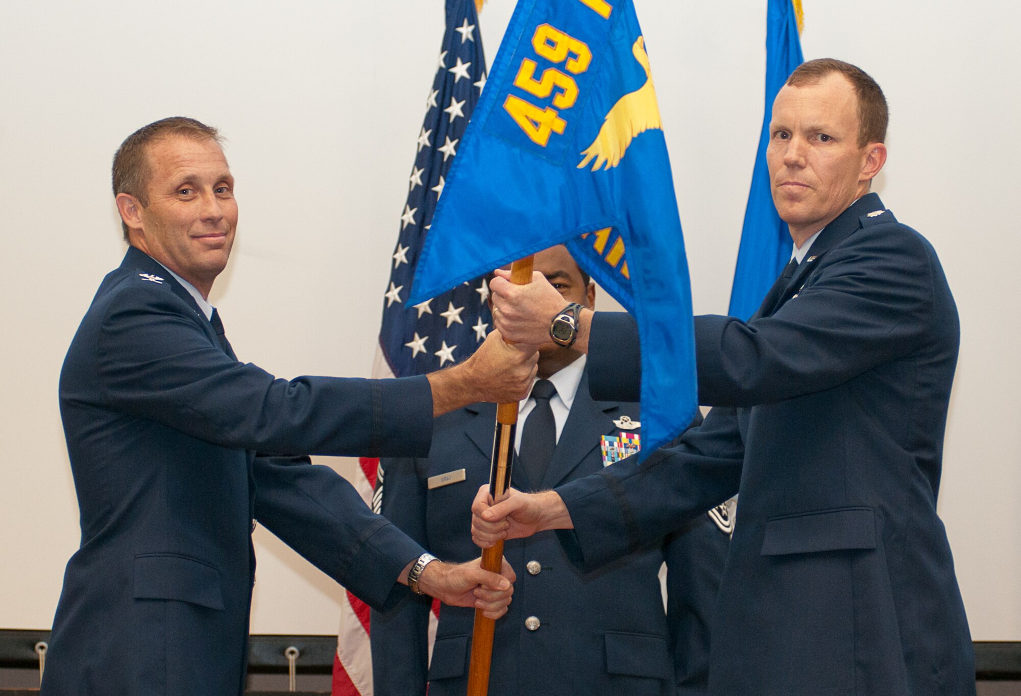 JOINT BASE ANDREWS, Md. – Lt. Col. Mark Deresky (right) accepts the 756th Air Refueling Squadron guidon from Col. Matthew Burger, 459th Operations Group commander, during a change of command ceremony here Aug. 13, 2011. The 756th ARS paid tribute to Lt. Col. Stephen Browning as he becomes deputy commander of the 459th Operations Group and welcomed Colonel Deresky as the new 756th ARS commander. (U.S. Air Force photo/Staff Sgt. Sophia Piellusch)