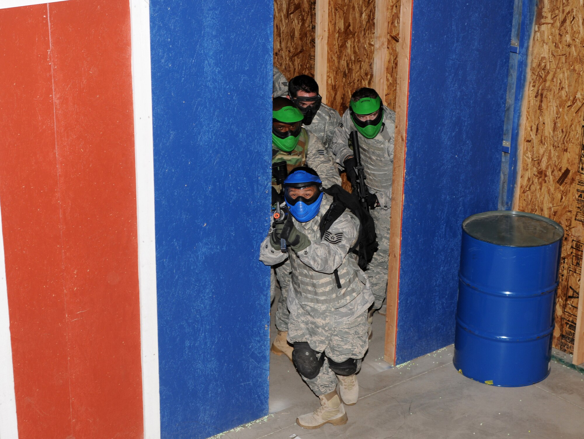 Airmen from the 161st Air Refueling Wing Security Forces Squadron received  close quarters tactic training at a local airsoft course in Gilbert Ariz., August 13, 2011. The training facility provides several real world scenarios in an urban enviroment to prepare Airmen for combat. (Released/ U.S. Air Force A1C Rashaunda Williams.)