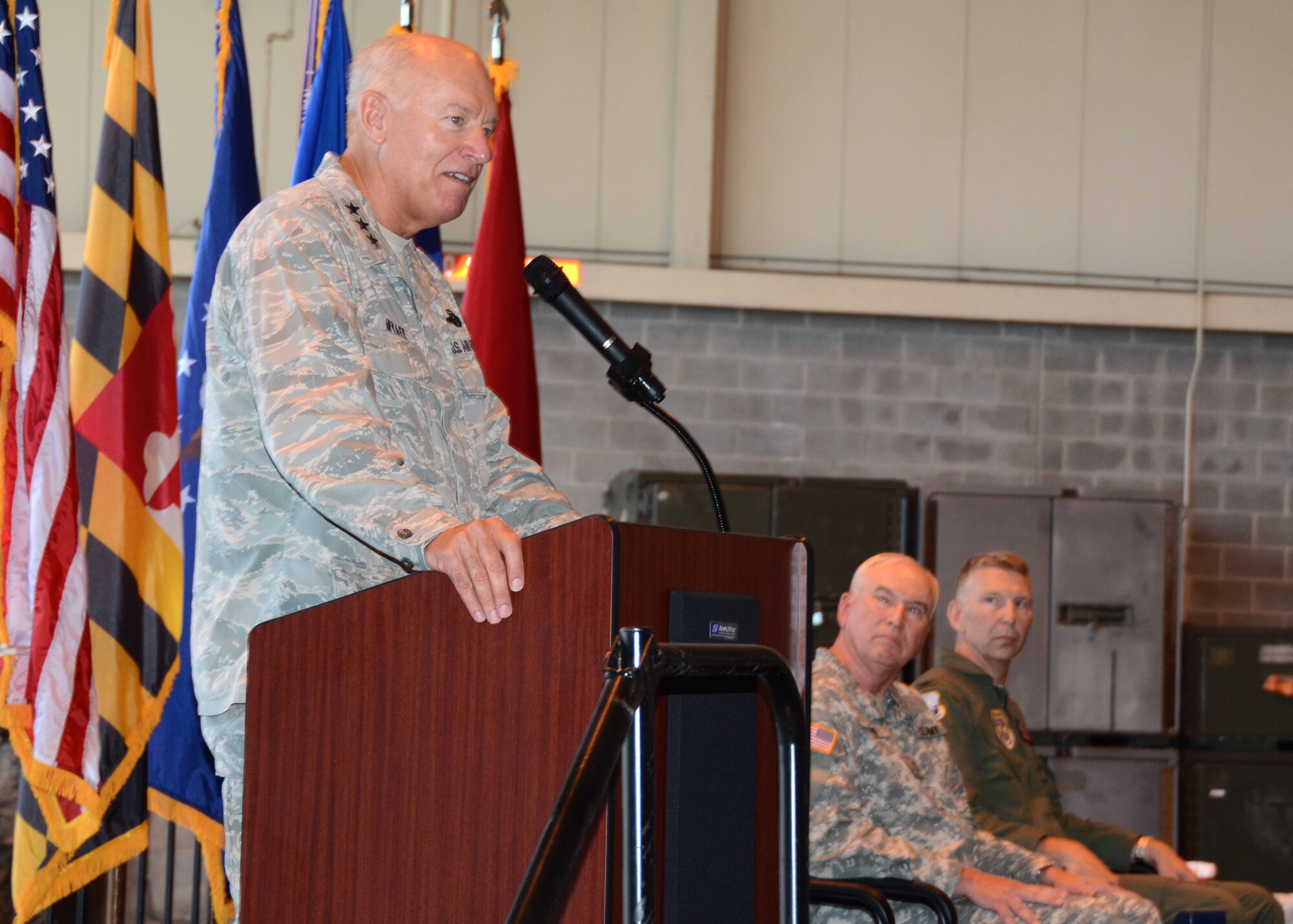 Lt. Gen. Harry M. Wyatt III, Director, Air National Guard, speaks during an arrival ceremony for the new C-27J Spartan, August 13, 2011 at Warfield Air National Guard Base, Baltimore, MD while (L-R) U.S. Army Maj. Gen.  James A. Atkins, Adjutant General and Col. Thomas E. Hans, commander 135th Airlift Group, watch.  The ceremony marks the transition to the C-27J Spartan from the C-130J Hercules, which the 175th Wing first dedicated in 1999.  (U.S. Air Force photo by Staff Sgt. Benjamin Hughes/RELEASED)