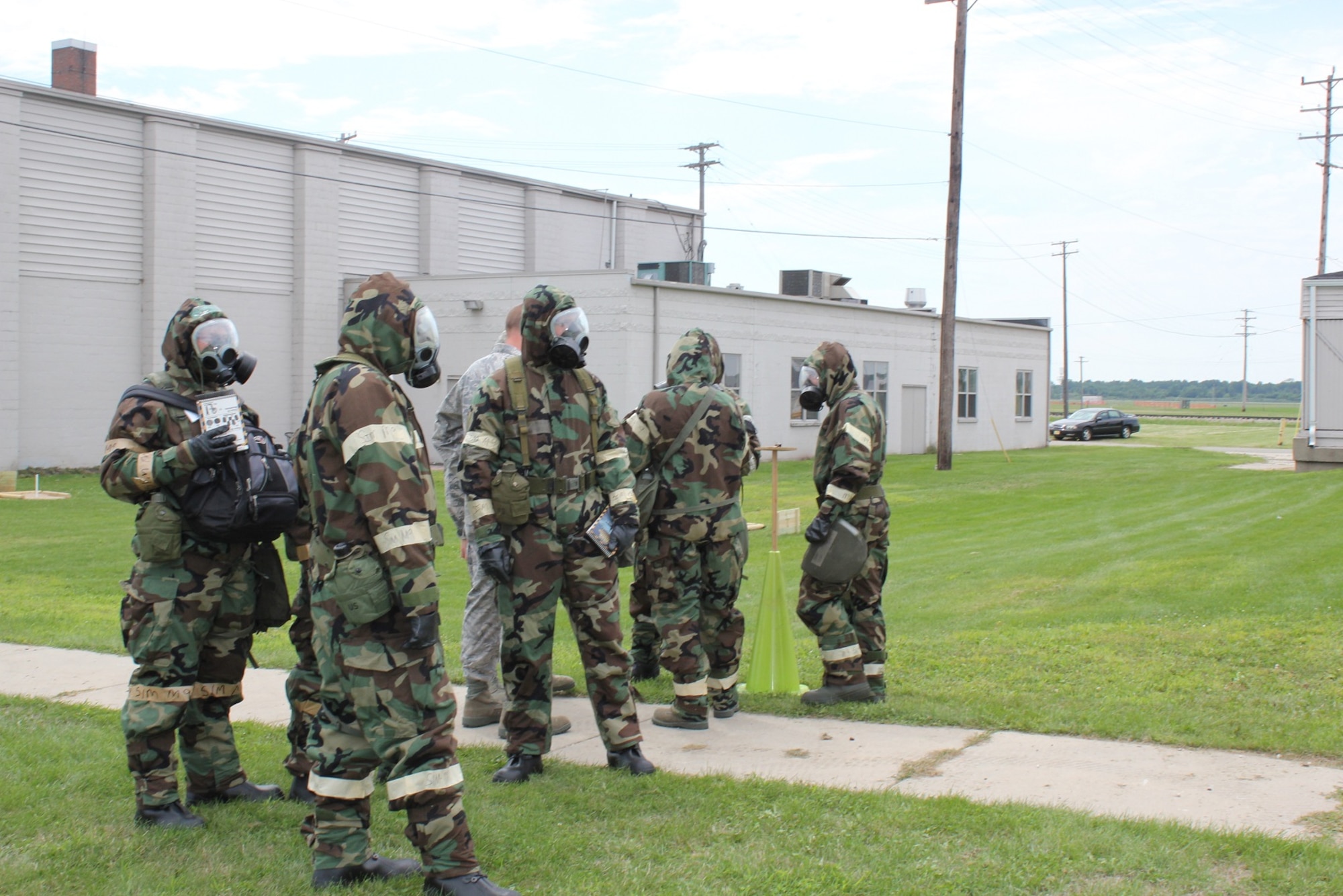 Airmen completely donned MOPP gear and practiced PAR Team training during Survival Skills training held at Selfridge Air National Guard Base on August 13.  During the exercise, the airmen were taught how to identify and mark UXOs, identify contamination on liquid detection points, and use the Airman's Pamphlet 10-100. (USAF photo by Capt. Penny Carroll)
