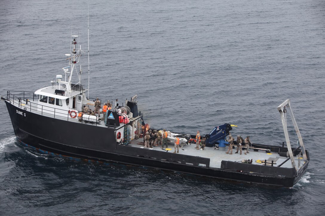 Marines with the 11th Marine Expeditionary Unit's maritime raid force boards and searches a vessel miles from Southern California's San Clemente Island during counter-piracy and counter-terrorism training Aug. 14. The unit embarked the amphibious assault ship Makin Island and the amphibious transport dock New Orleans in San Diego and sailed Aug. 10 to begin its first seagoing exercise since becoming a complete Marine air-ground task force in May.