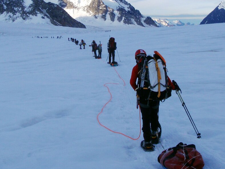 MOUNT MCKINLEY, Alaska -- Members of the 212th Rescue Squadron on the 2011 Combat Wounded Warriors Denali expedition make their way onward July 2. The pararescuemen supported a three-week, grassroots wounded-warrior project to take injured veterans up Mount McKinley starting Jun 23.