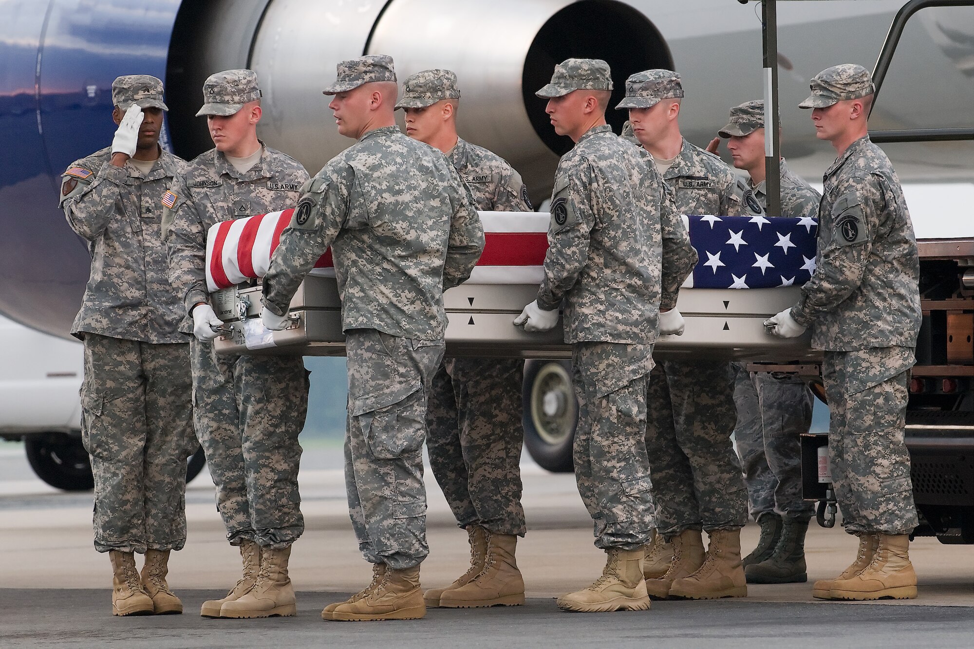 A U.S. Army carry team transfers the remains of Army 2nd Lt. Joe L. Cunningham, of Kingston, Okla., at Dover Air Force Base, Del., Aug. 15, 2011. Cunningham was assigned to the 1st Battalion, 179th Infantry Regiment, 45th Infantry Brigade Combat Team, Oklahoma Army National Guard, Stillwater, Okla. (U.S. Air Force photo/Steve Kotecki)