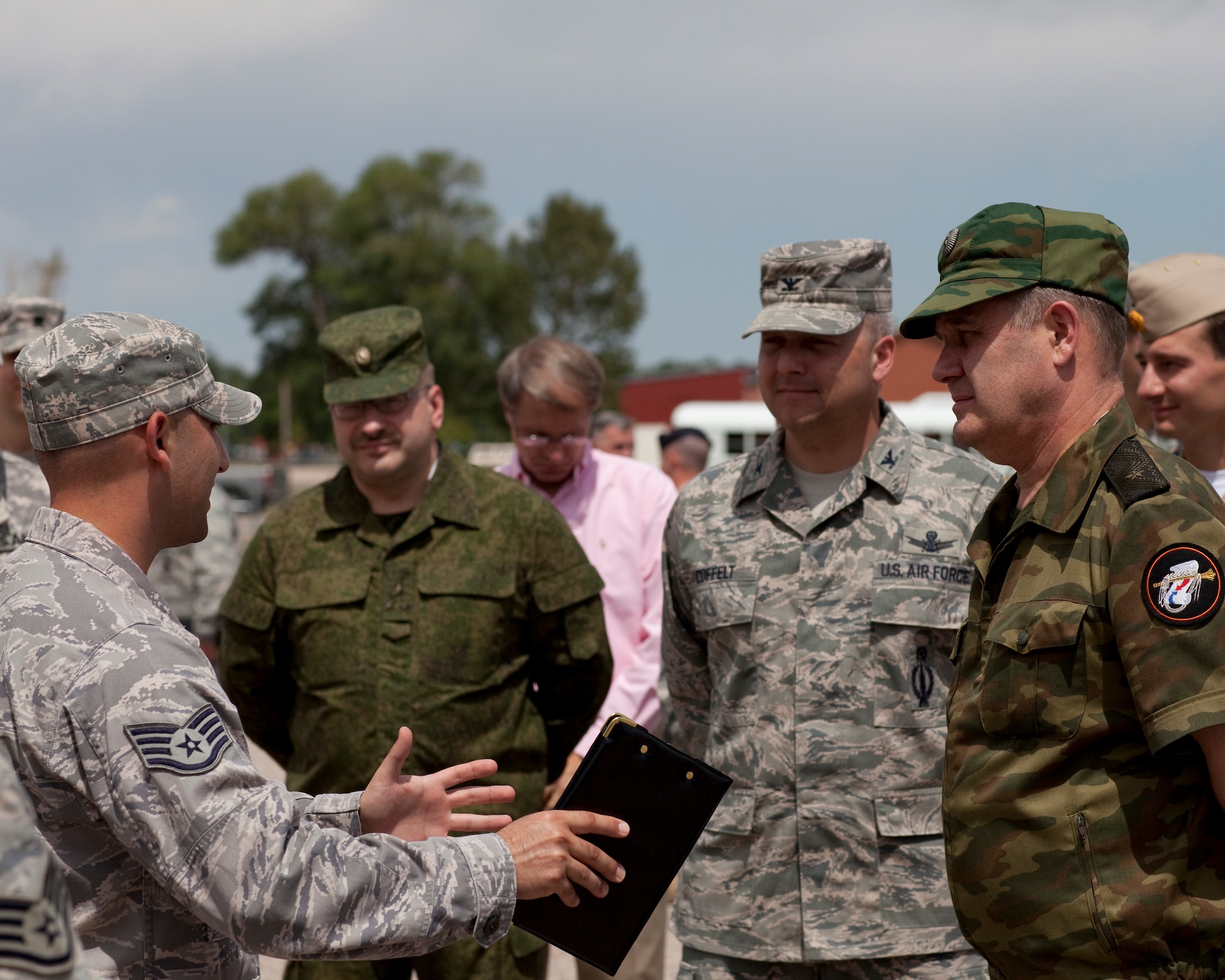 Col. Christopher Coffelt, 90th Missile Wing commander, and Brig. Gen. Vladimir Iskulov , Glavnoye Razedyvatel’noye Upravleniye directorate chief, Russian Federation Minister of Defense General Staff communicate through the use of a linguist Tuesday August 09, 2011. (U.S. Air Force photo by Matt Bilden)