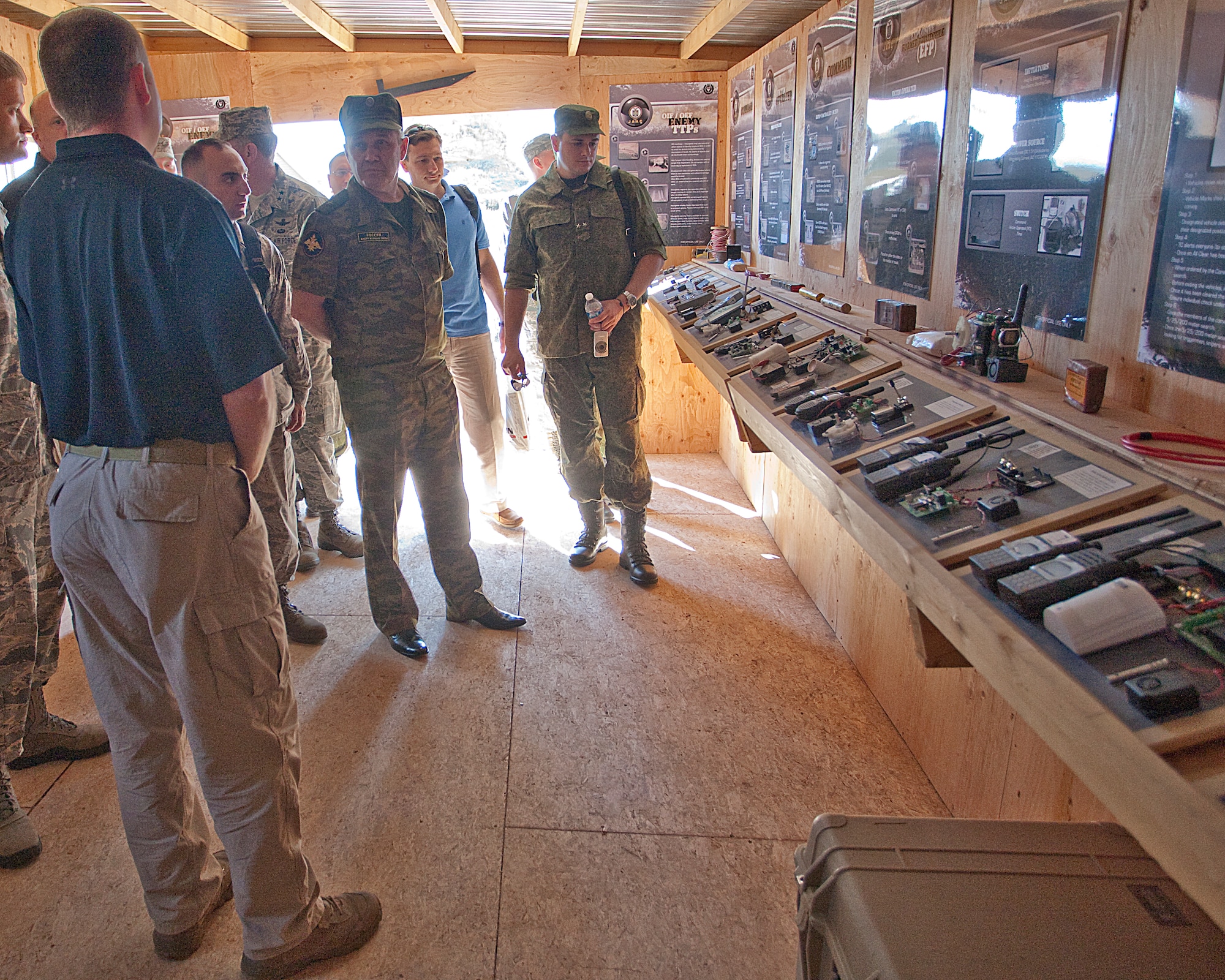 Joseph Biberstone, U.S. Air Force Explosive Ordnance Disposal contractor, briefs Brig. Gen. Vladimir Iskulov, Glavnoye Razedyvatel’noye Upravleniye directorate chief, Russian Federation Minister of Defense General Staff, on various EOD equipment during their visit to Camp Guernsey, Wyo., as part of Crimson Rider Wednesday August 10, 2011.  Crimson Rider is a security demonstration designed to exchange best practices for security, safety, and control of nuclear weapons during transport. (U.S. Air Force photo by Matt Bilden)