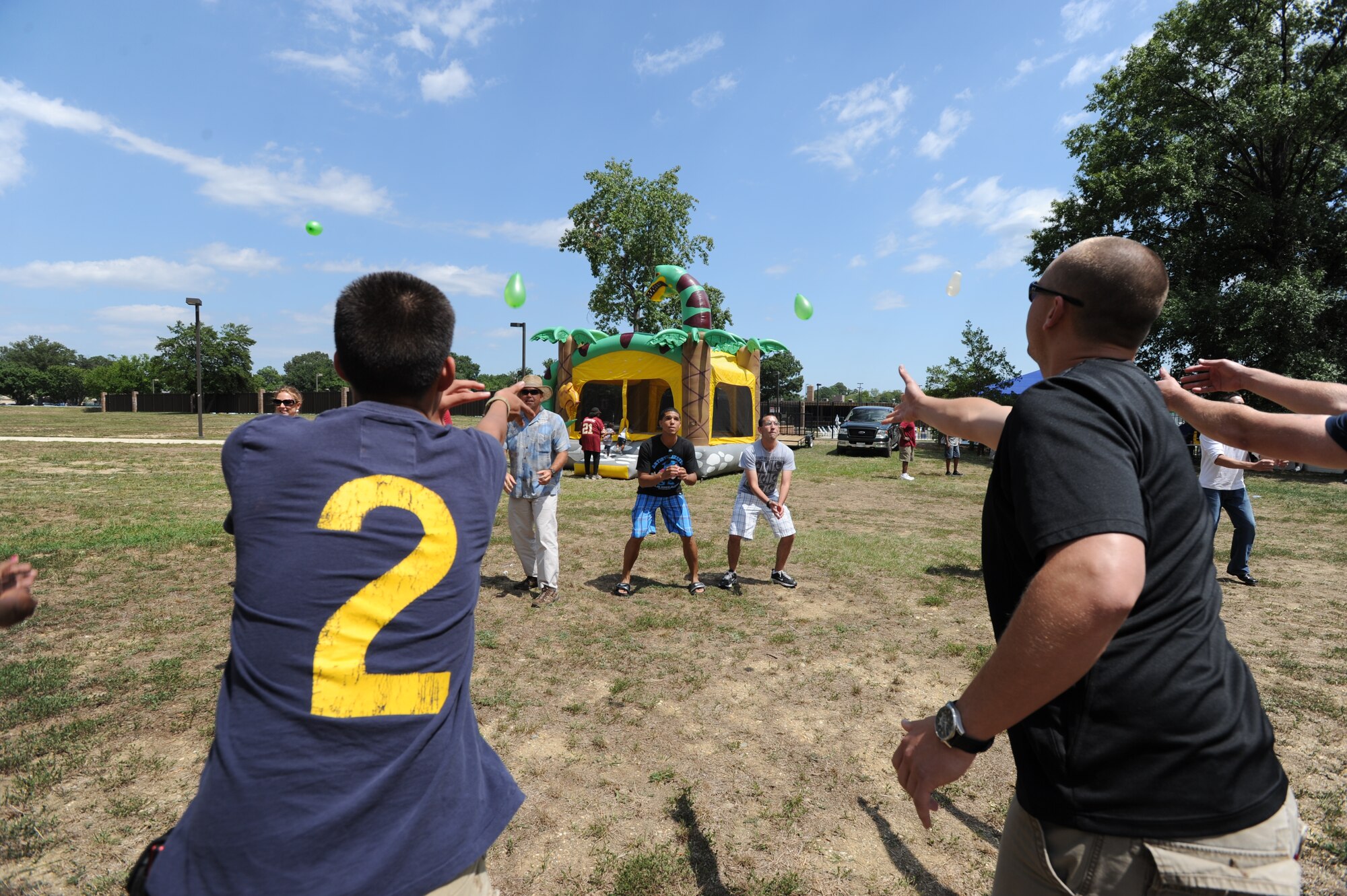 Air Force District of Washington members and their families gathered for food, sun, water and games during the AFDW Family Picnic on Joint Base Andrews, Md. Aug. 12. Leadership sponsored the half-day event, full of things to do for all ages, to bring together workers and their families for a day of fun, relaxation and camraderie. (U.S. Air Force photo by Staff Sgt. Christopher Ruano)