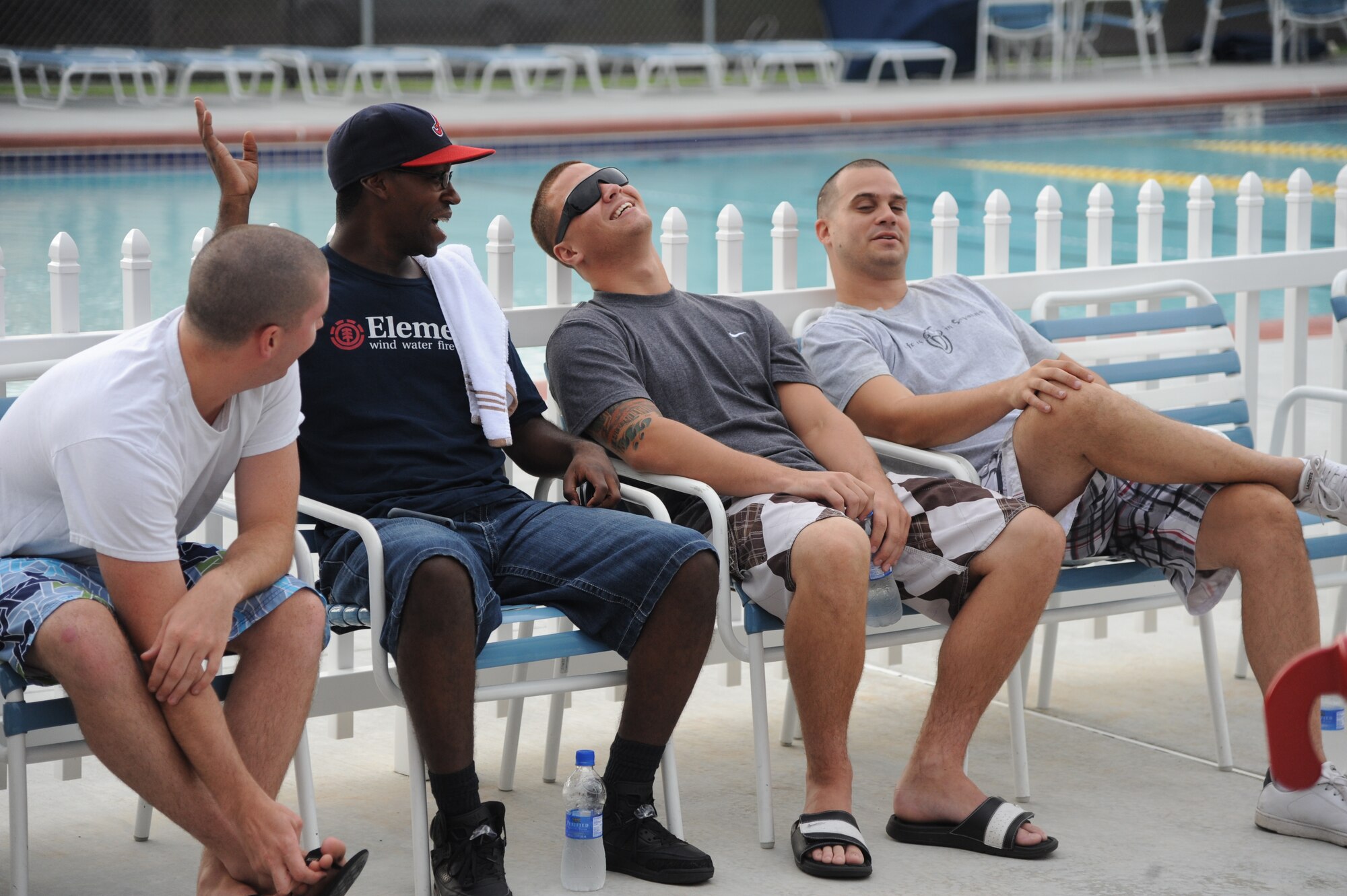 Airmen stationed at Moody Air Force Base, Ga., share laughs during Airmen Appreciation Night hosted by the Airmen Committed to Excellence committee Aug. 12, 2011. The event was held for the base’s senior airmen and below. (U.S. Air Force photo by Airman 1st Class Paul Francis/Released)