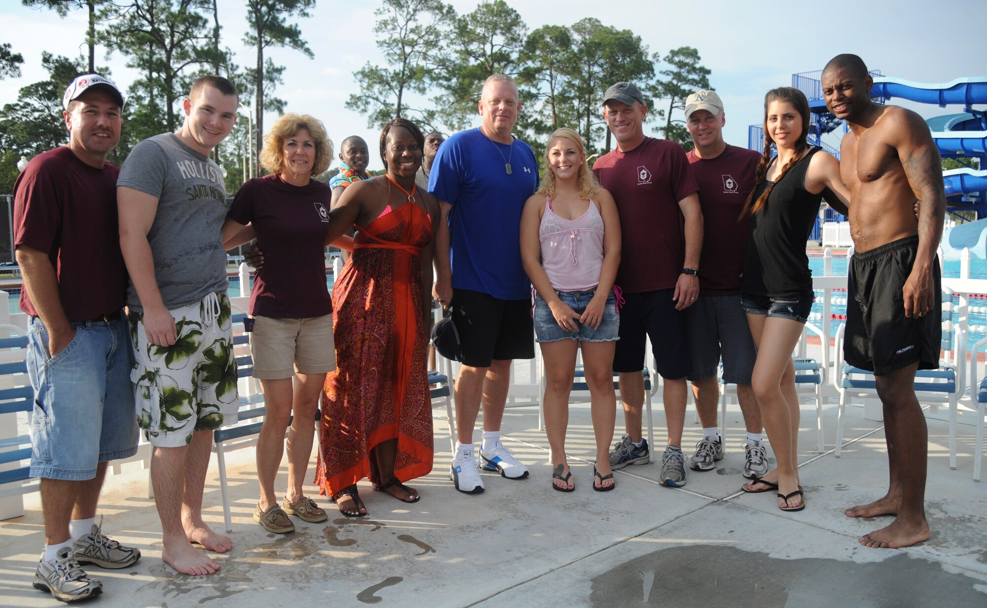 The Airmen Committed to Excellence committee takes a photo along with the chief master sergeants during Airmen Appreciation Night at Moody Air Force Base, Ga., Aug. 12, 2011. The chiefs and ACE committee held the event to provide an evening of fun and relaxation for the base’s senior airmen and below. (U.S. Air Force photo by Airman 1st Class Paul Francis/Released)