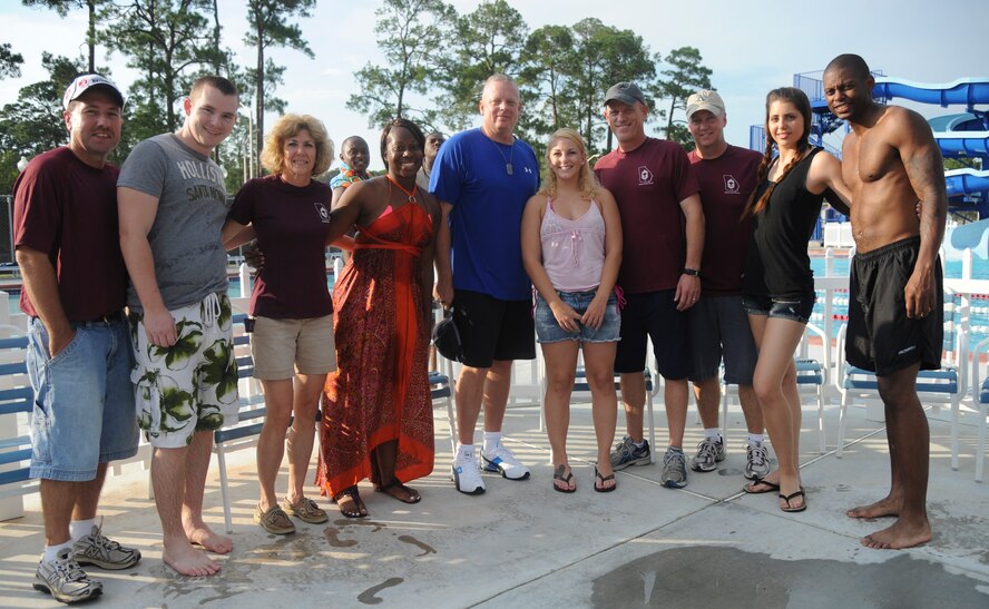 The Airmen Committed to Excellence committee takes a photo along with the chief master sergeants during Airmen Appreciation Night at Moody Air Force Base, Ga., Aug. 12, 2011. The chiefs and ACE committee held the event to provide an evening of fun and relaxation for the base’s senior airmen and below. (U.S. Air Force photo by Airman 1st Class Paul Francis/Released)