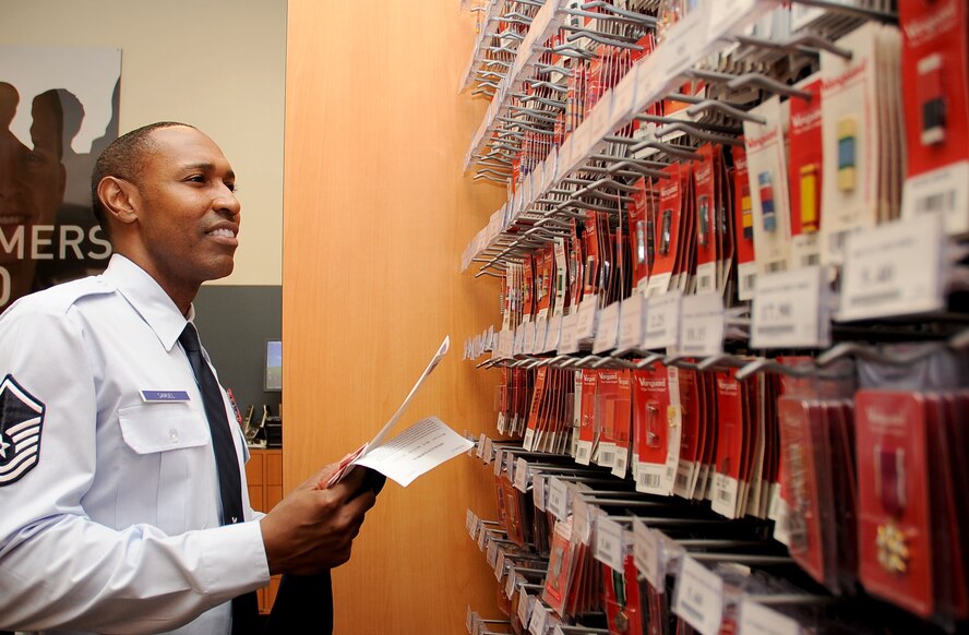 With the Air Force ribbon chart in hand, Master Sgt. Kelvin Samuel, 2nd Bomb Wing Safety, searches for new ribbons at the clothing sales store on Barksdale Air Force Base, La., Aug. 15. Having recently returned from a deployment in Afghanistan, Samuel wants to keep up with Air Force regulations and make sure his ribbon rack is up to date. (U.S. Air Force photo/Senior Airman Amber Ashcraft) (RELEASED)