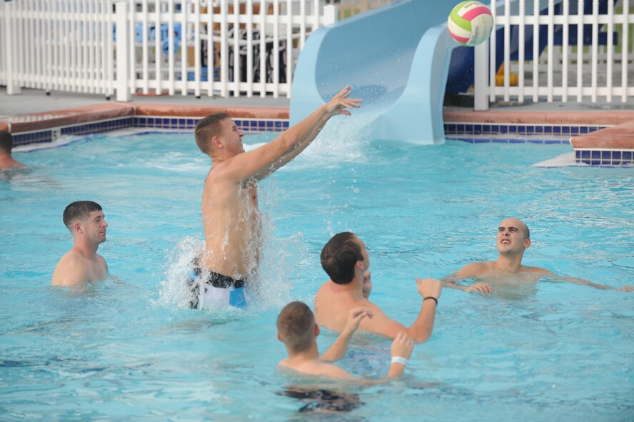 U.S. Air Force Airman 1st Class Corey Helmick, 23rd Operations Support Squadron air traffic controller, hits a ball around with fellow Airmen during Airmen Appreciation Night at Moody Air Force Base, Ga., Aug. 12, 2011. The event was sponsored by the Airmen Committed to Excellence committee and 23rd Force Support Squadron. (U.S. Air Force photo by Airman 1st Class Paul Francis/Released)