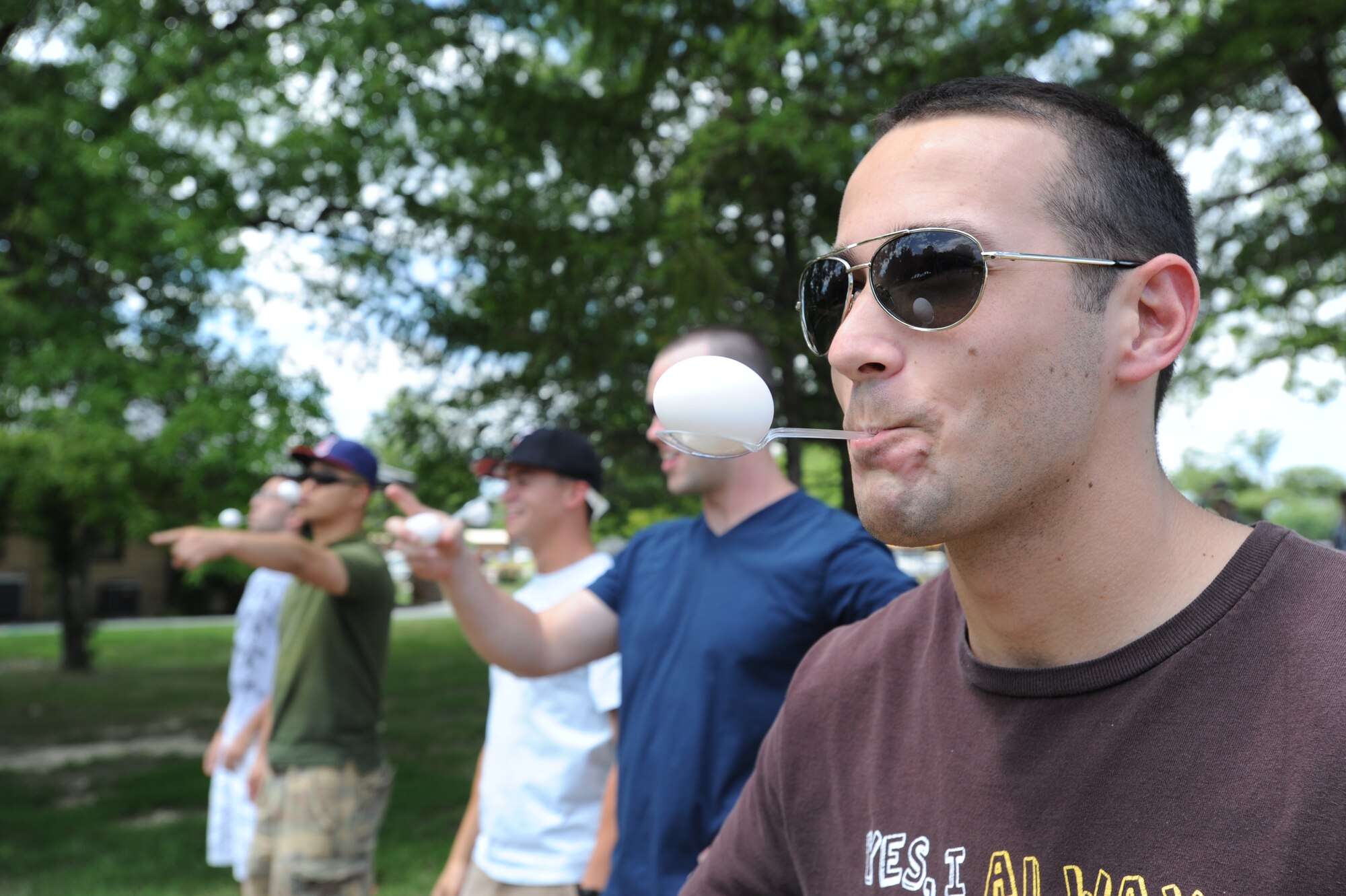 Senior Airman Aric Noblitt, Air Force District of Washington contract specialist, balances an egg in preparation for a relay event at the AFDW family summer picnic on Joint Base Andrews, Md. Aug. 12. Airman Noblitt received 3rd place in the relay event. (U.S. Air Force photo by Staff Sgt. Christopher Ruano)