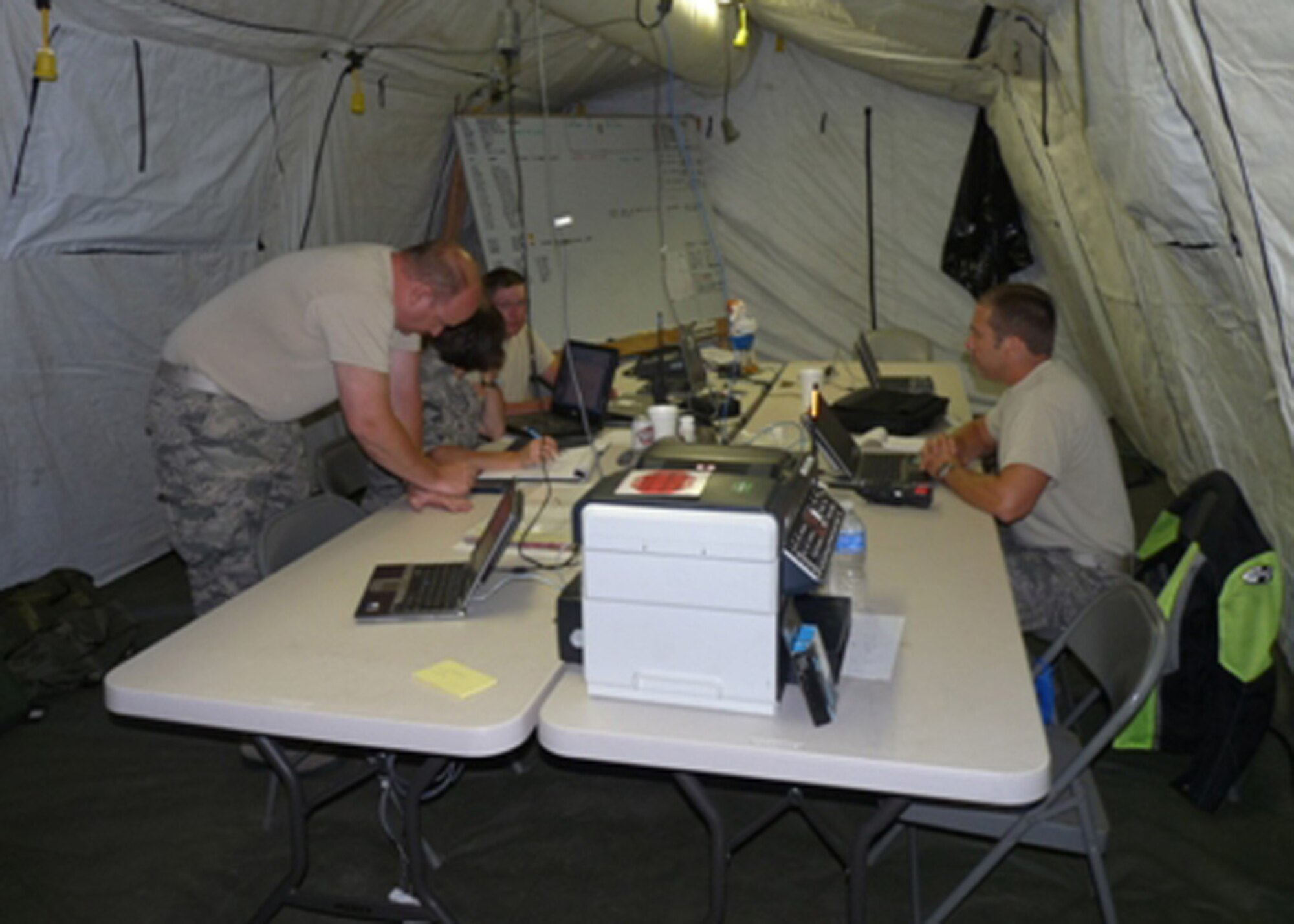 Members of the 239th Combat Communications Squadron, Missouri Air National Guard, man the command post at the unit’s field communications station at Jefferson Barracks. (Photo by Bill Phelan)   