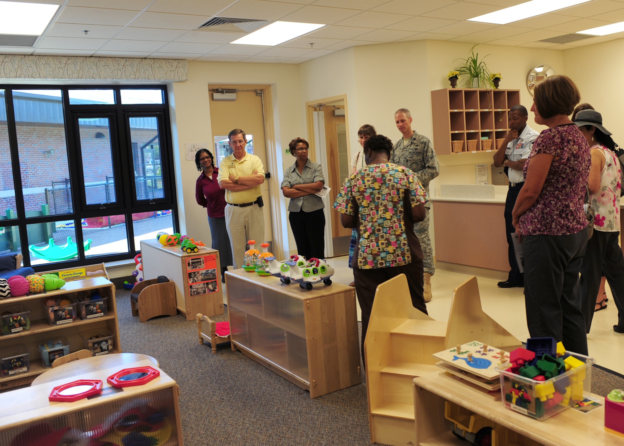 Debra Brandon, 23rd Force Support Squadron lead teacher, gives a tour of the Child Development Center II after the grand opening ceremony at Moody Air Force Base, Ga., Aug. 15, 2011. Brandon has provided child care for 10 years, with the last eight of those years being at Moody.  (U.S. Air Force photo by Senior Airman Stephanie Mancha/Released)
