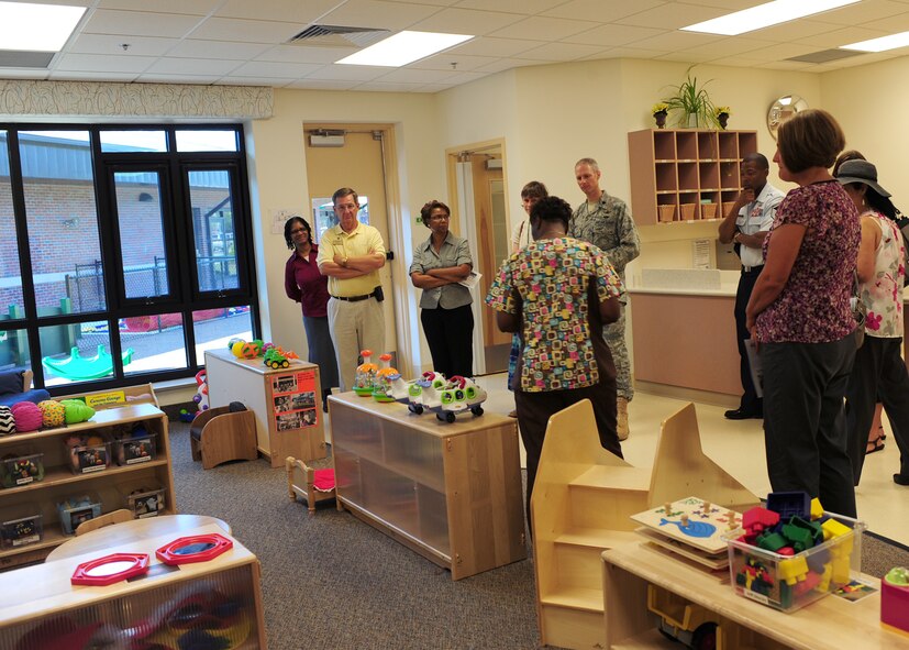 Debra Brandon, 23rd Force Support Squadron lead teacher, gives a tour of the Child Development Center II after the grand opening ceremony at Moody Air Force Base, Ga., Aug. 15, 2011. Brandon has provided child care for 10 years, with the last eight of those years being at Moody.  (U.S. Air Force photo by Senior Airman Stephanie Mancha/Released)