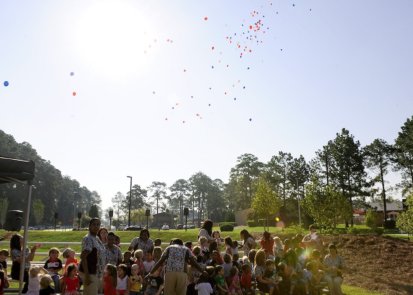 Children release balloons into the sky during the grand opening ceremony of the Child Development Center II at Moody Air Force Base, Ga., Aug. 15, 2011. The CDC II has five infant rooms, six pre-toddler rooms, six toddler rooms and four preschool rooms, along with administrative offices, a break room, a kitchen, laundry and janitorial rooms, infant nursing rooms, training rooms and four play yards. (U.S. Air Force photo by Senior Airman Stephanie Mancha/Released)