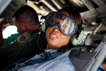 Florida Lt. Gov. Jennifer Carroll sits in an HH-60G Pave Hawk prior to talking off to see an aerial view of Avon Park Air Force Range, Fla., Aug. 2, 2011. During the flight, the 23rd Wing Detachment 1 commander showcased the training capabilities and the diverse ecosystems that coexist on base. (U.S. Air Force photo by Andrea Thacker/Released)