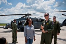 U.S. Air Force Col. Billy Thompson, 23rd Wing commander from Moody Air Force Base, Ga., right, explains a little about the HH-60G Pave Hawk to Florida Lt. Gov. Jennifer Carroll, left, during a visit to Avon Park Air Force Range, Fla., Aug. 2, 2011. Carroll and other guests flew in a Pave Hawk to see an aerial view of APAFR and to witness firsthand the training areas and the diverse ecosystems that coexist on base. (U.S. Air Force photo by Andrea Thacker/Released)
