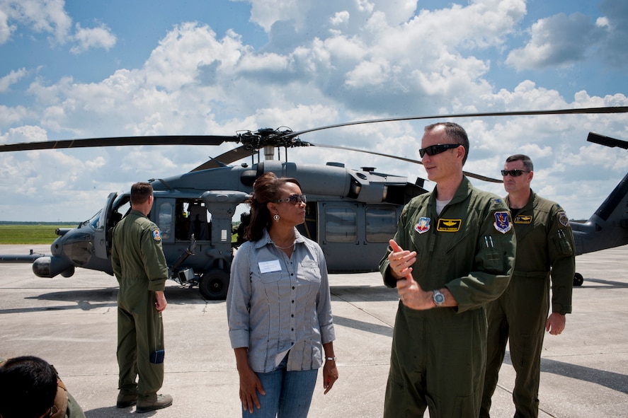 U.S. Air Force Col. Billy Thompson, 23rd Wing commander from Moody Air Force Base, Ga., right, explains a little about the HH-60G Pave Hawk to Florida Lt. Gov. Jennifer Carroll, left, during a visit to Avon Park Air Force Range, Fla., Aug. 2, 2011. Carroll and other guests flew in a Pave Hawk to see an aerial view of APAFR and to witness firsthand the training areas and the diverse ecosystems that coexist on base. (U.S. Air Force photo by Andrea Thacker/Released)