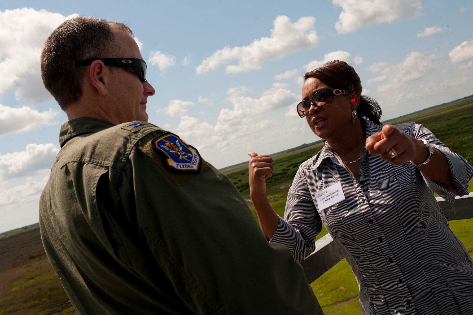 Florida Lt. Gov. Jennifer Carroll, right, asks U.S. Air Force Col. Billy Thompson, 23rd Wing commander from Moody Air Force Base, Ga., about the capabilities of the A-10C Thunderbolt II during an event held at Avon Park Air Force Range, Fla., Aug. 2, 2011. During the visit, attendees had the opportunity to view the A-10C Thunderbolt II in action on the range, see several natural habitats found in few other places and they also learned how the staff manages natural habitats to protect the unique biodiversity. (U.S. Air Force photo by Andrea Thacker/Released)


