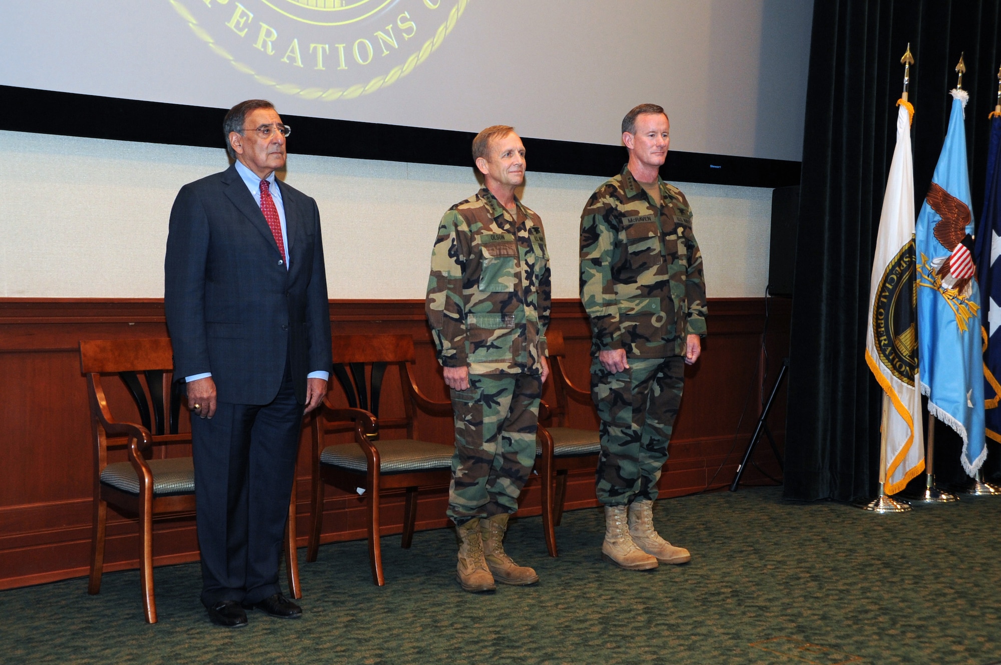 From left to right: Defense Secretary Leon E. Panetta, Adm. Eric T. Olson , and Adm. William H. McRaven stand during the U.S. Special Operations Command change of command ceremony held at the Davis Conference Center, MacDill Air Force Base, Fla., Aug. 8.  McRaven assumed command from Olson, becoming the ninth commander of USSOCOM. (US Special Operation Command photo by Mike Bottoms)