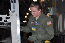 Senior Airman Erin Smith, an Air Force Reserve aeromedical evacuation technician with the 302nd Airlift Wing's 34th Aeromedical Evacuation Squadron secures a stanchion during the configuration of a U.S. Air Force C-17 during the 2011 Air Mobility Rodeo competition at Joint Base Lewis-McChord, Wash.  (U.S. Air Force photo/Capt. Corinna Jones)
