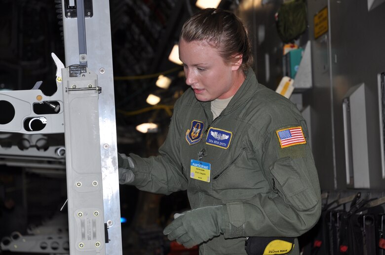 Senior Airman Erin Smith, an Air Force Reserve aeromedical evacuation technician with the 302nd Airlift Wing's 34th Aeromedical Evacuation Squadron secures a stanchion during the configuration of a U.S. Air Force C-17 during the 2011 Air Mobility Rodeo competition at Joint Base Lewis-McChord, Wash.  (U.S. Air Force photo/Capt. Corinna Jones)
