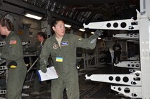 Capt. Carrie Williamson, a flight nurse with the 302nd Airlift Wing's 34th Aeromedical Evacuation Squadron and her aeromedical team conduct the final security check on the U.S. Air Force C-17 before reporting the aircraft secure and ready for patient enplaning. The 34th AES team members were named Best Aeromedical C-17 Configuration Team during the 2011 Air Mobility Rodeo competition at Joint Base Lewis-McChord, Wash. (U.S. Air Force photo/Capt. Corinna Jones)
