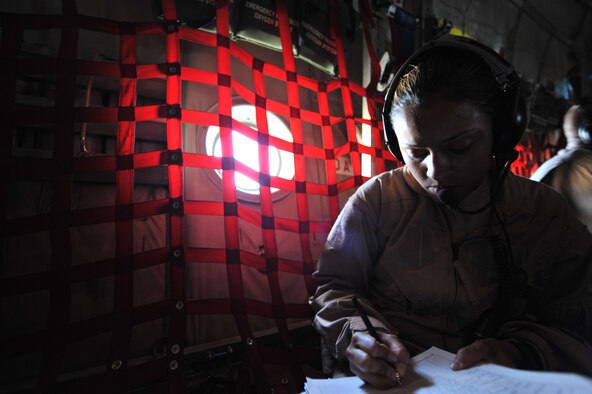 Senior Airman Samantha Gonzalez, 379th Expeditionary Aeromedical Evacuation Squadron aeromedical evacuation technician, inventories medical equipment on board a C-130 Hercules assigned to the 746th Expeditionary Airlift Squadron during an aeromedical evacuation mission to Afghanistan on Aug. 7, 2011. Gonzalez is deployed from Peterson Air Force Base, Colo. (U.S. Air Force photo/Senior Airman Paul Labbe) 