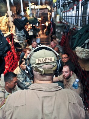 Tech. Sgt. Anthony Flores, 746th Expeditionary Airlift Squadron loadmaster, briefs passengers and patients on board a C-130 Hercules, on Aug. 6, 2011. Flores is deployed from Pope Field, N.C. (U.S. Air Force photo/Senior Airman Paul Labbe) 