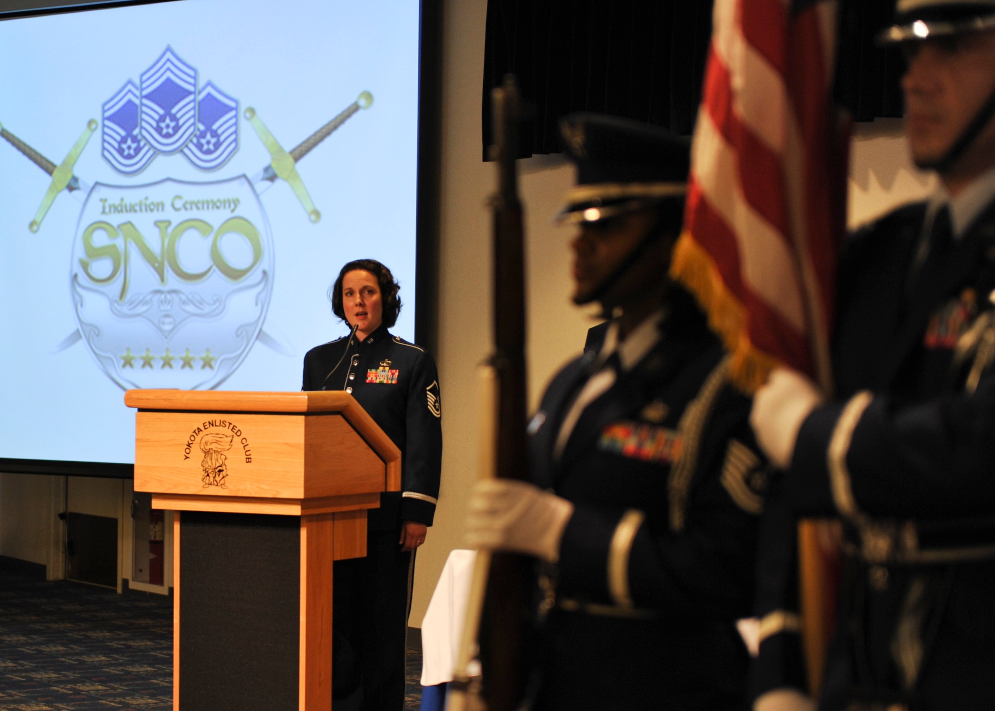 YOKOTA AIR BASE, Japan -- Master Sgt. Paula Goetz, Air Force Band of the Pacific-Asia vocalist, sings the National Anthem during the opening of the Senior Non-Commissioned Officer Induction Ceremony at Yokota Air Base, Japan, Aug. 11, 2011. The ceremony recognizes individuals who have attained the rank of master sergeant, marking their transition to a senior-leadership role. (U.S. Air Force photo/Senior Airman Andrea Salazar)