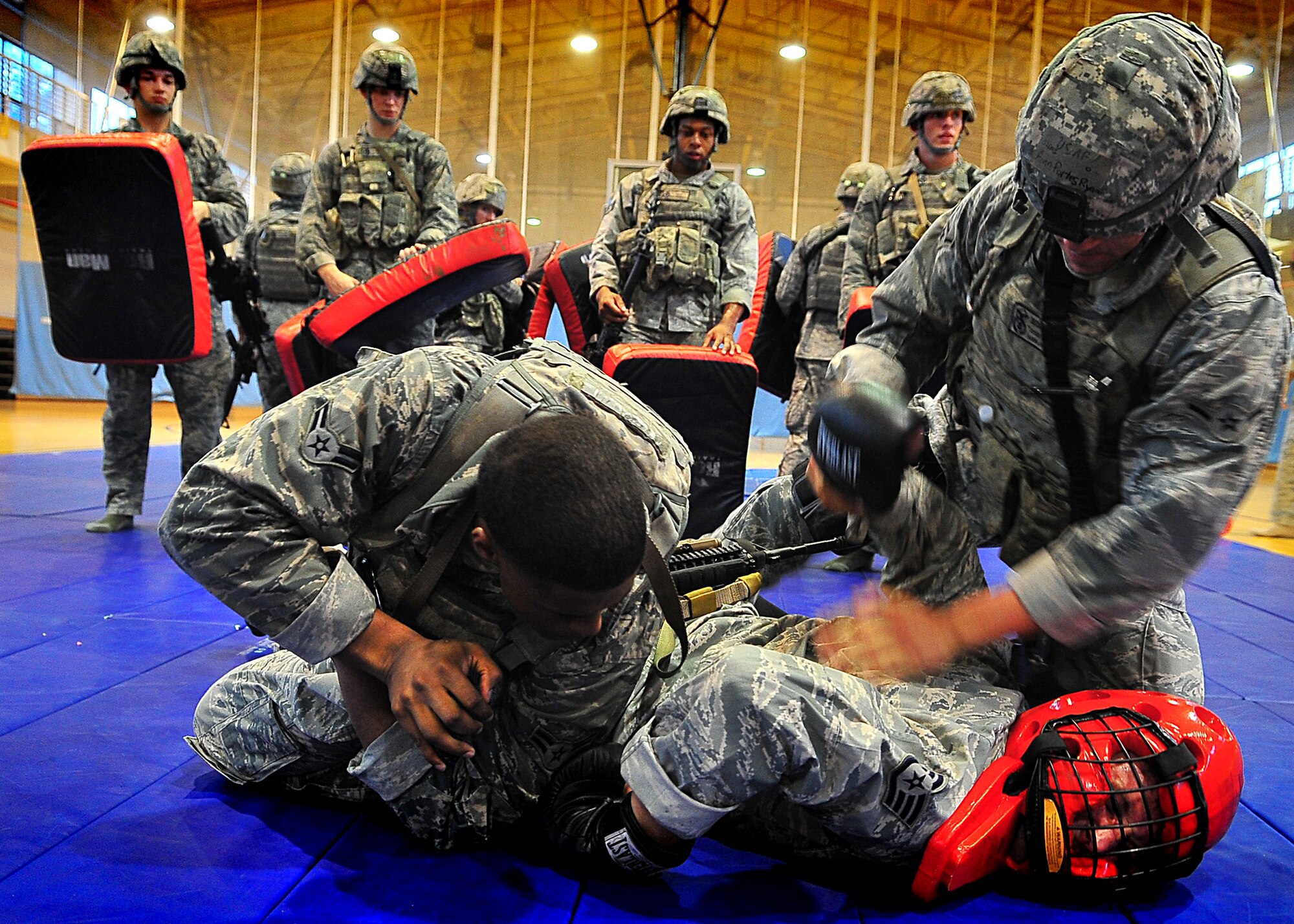 Day four and five of the QRT training, August 12-13, rigorous physical training continued as obstacles increased with difficulty testing not only their strength but also their capabilities to act as a cohesive squad. Day four, SF Airmen were taught how to respond to an active shooter and/or hostage scenario in the Base Exchange and the base dormitories, as well as extraction of an active shooter in a vehicle. Day five SF Airmen performed combative training and practical exercises. Physical training sessions were themed in memory of the 31 warriors lost in Afghanistan, August 7, 2011, by each volunteer completing 31 of each exercise throughout the course. A QRT member provides immediate response to any high risk situation on Osan Air Base to include barricaded suspects, workplace violence, domestic violence and abuse response, school violence, and disaster response. (Photo by Staff Sgt. Daylena Gonzalez)  