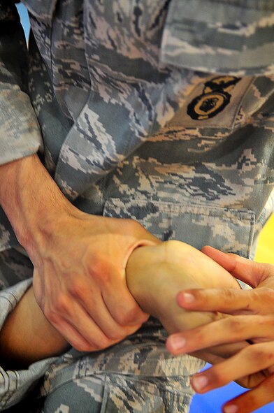 Day four and five of the QRT training, August 12-13, rigorous physical training continued as obstacles increased with difficulty testing not only their strength but also their capabilities to act as a cohesive squad. Day four, SF Airmen were taught how to respond to an active shooter and/or hostage scenario in the Base Exchange and the base dormitories, as well as extraction of an active shooter in a vehicle. Day five SF Airmen performed combative training and practical exercises. Physical training sessions were themed in memory of the 31 warriors lost in Afghanistan, August 7, 2011, by each volunteer completing 31 of each exercise throughout the course. A QRT member provides immediate response to any high risk situation on Osan Air Base to include barricaded suspects, workplace violence, domestic violence and abuse response, school violence, and disaster response. (Photo by Staff Sgt. Daylena Gonzalez)  