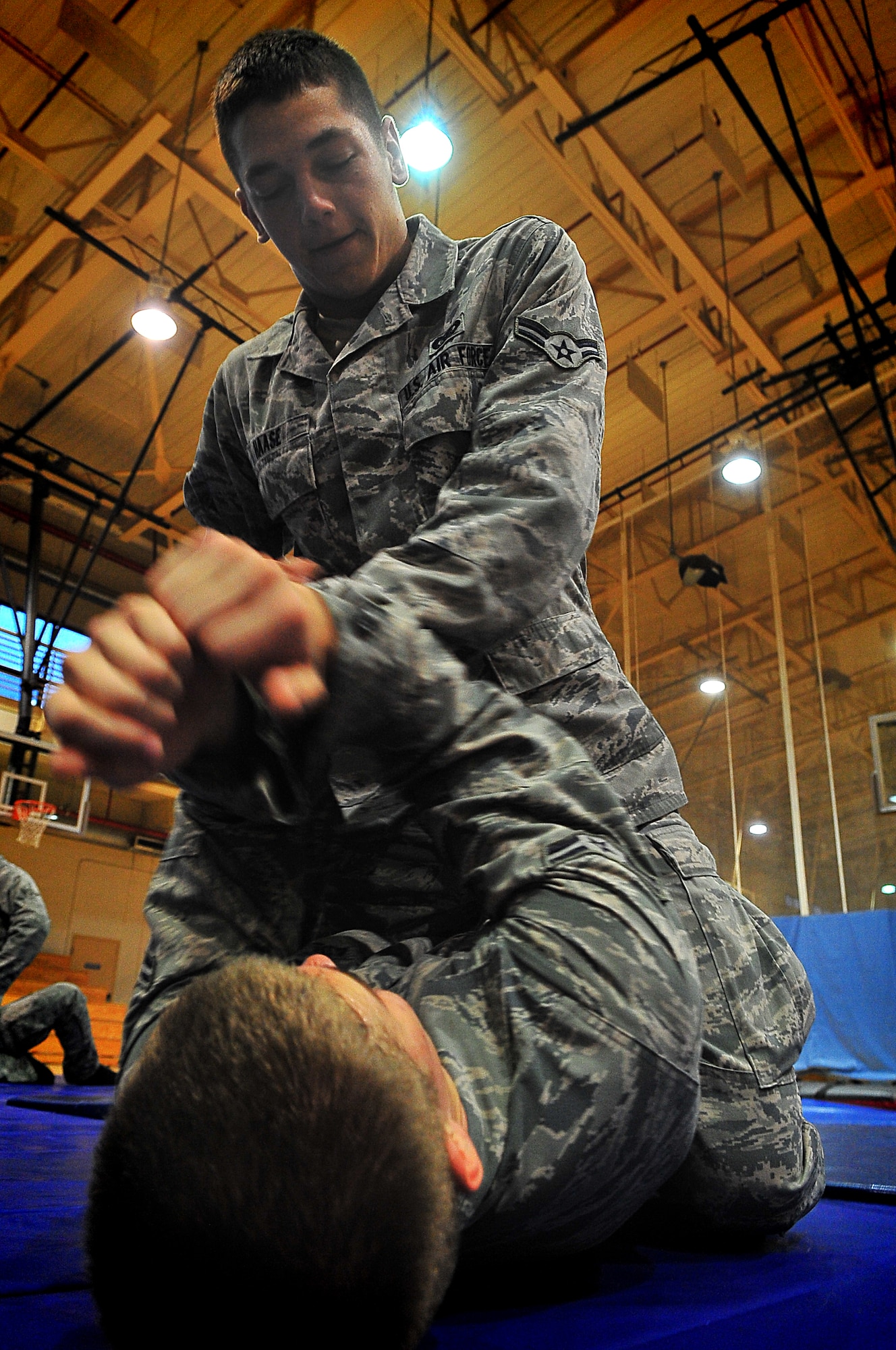 Day four and five of the QRT training, August 12-13, rigorous physical training continued as obstacles increased with difficulty testing not only their strength but also their capabilities to act as a cohesive squad. Day four, SF Airmen were taught how to respond to an active shooter and/or hostage scenario in the Base Exchange and the base dormitories, as well as extraction of an active shooter in a vehicle. Day five SF Airmen performed combative training and practical exercises. Physical training sessions were themed in memory of the 31 warriors lost in Afghanistan, August 7, 2011, by each volunteer completing 31 of each exercise throughout the course. A QRT member provides immediate response to any high risk situation on Osan Air Base to include barricaded suspects, workplace violence, domestic violence and abuse response, school violence, and disaster response. (Photo by Staff Sgt. Daylena Gonzalez)  