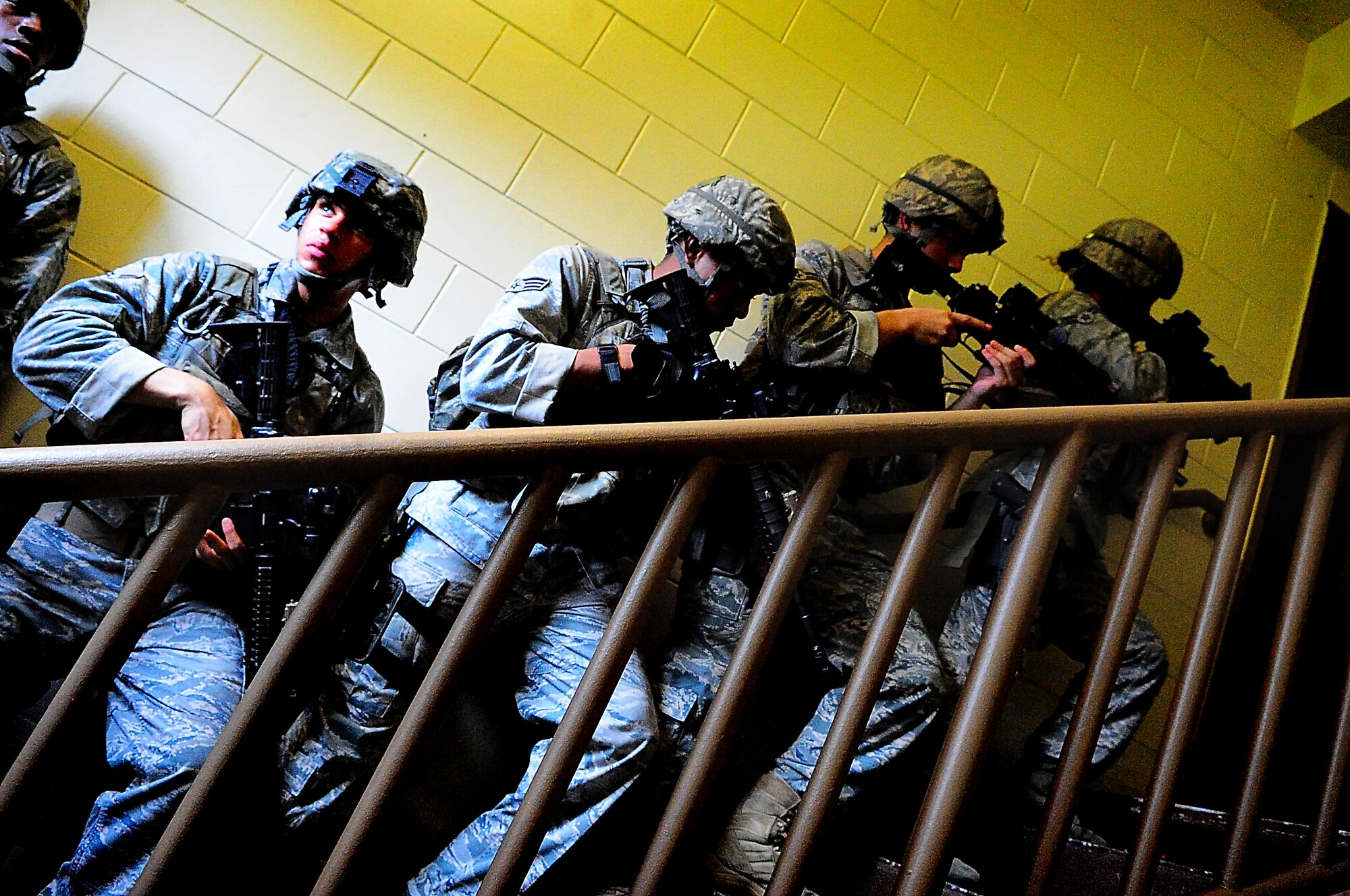 Day four and five of the QRT training, August 12-13, rigorous physical training continued as obstacles increased with difficulty testing not only their strength but also their capabilities to act as a cohesive squad. Day four, SF Airmen were taught how to respond to an active shooter and/or hostage scenario in the Base Exchange and the base dormitories, as well as extraction of an active shooter in a vehicle. Day five SF Airmen performed combative training and practical exercises. Physical training sessions were themed in memory of the 31 warriors lost in Afghanistan, August 7, 2011, by each volunteer completing 31 of each exercise throughout the course. A QRT member provides immediate response to any high risk situation on Osan Air Base to include barricaded suspects, workplace violence, domestic violence and abuse response, school violence, and disaster response. (Photo by Staff Sgt. Daylena Gonzalez)  