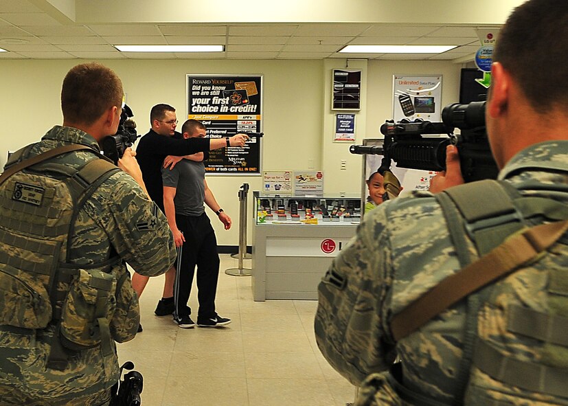 Day four and five of the QRT training, August 12-13, rigorous physical training continued as obstacles increased with difficulty testing not only their strength but also their capabilities to act as a cohesive squad. Day four, SF Airmen were taught how to respond to an active shooter and/or hostage scenario in the Base Exchange and the base dormitories, as well as extraction of an active shooter in a vehicle. Day five SF Airmen performed combative training and practical exercises. Physical training sessions were themed in memory of the 31 warriors lost in Afghanistan, August 7, 2011, by each volunteer completing 31 of each exercise throughout the course. A QRT member provides immediate response to any high risk situation on Osan Air Base to include barricaded suspects, workplace violence, domestic violence and abuse response, school violence, and disaster response. (Photo by Staff Sgt. Daylena Gonzalez)  