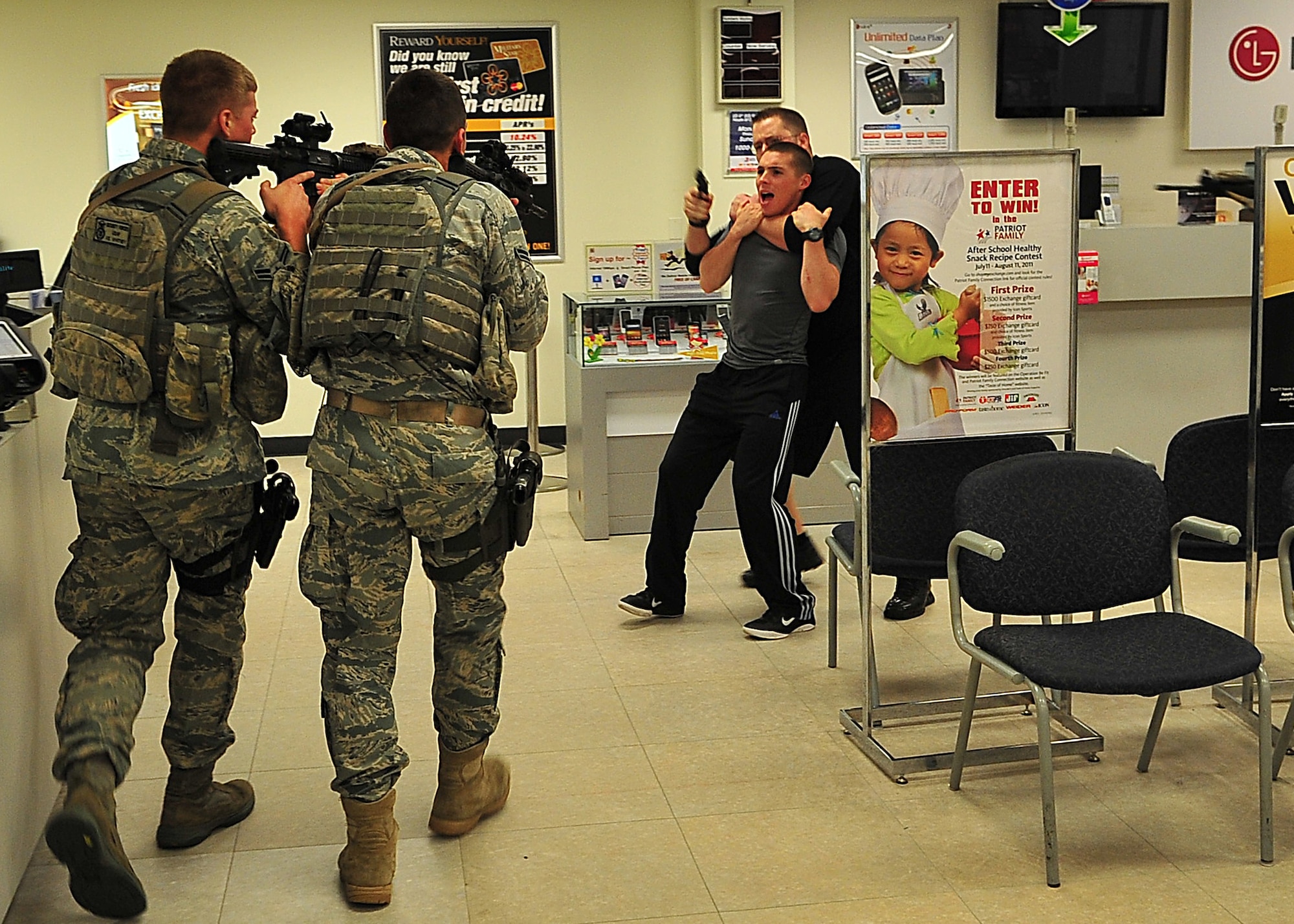 Day four and five of the QRT training, August 12-13, rigorous physical training continued as obstacles increased with difficulty testing not only their strength but also their capabilities to act as a cohesive squad. Day four, SF Airmen were taught how to respond to an active shooter and/or hostage scenario in the Base Exchange and the base dormitories, as well as extraction of an active shooter in a vehicle. Day five SF Airmen performed combative training and practical exercises. Physical training sessions were themed in memory of the 31 warriors lost in Afghanistan, August 7, 2011, by each volunteer completing 31 of each exercise throughout the course. A QRT member provides immediate response to any high risk situation on Osan Air Base to include barricaded suspects, workplace violence, domestic violence and abuse response, school violence, and disaster response. (Photo by Staff Sgt. Daylena Gonzalez)  