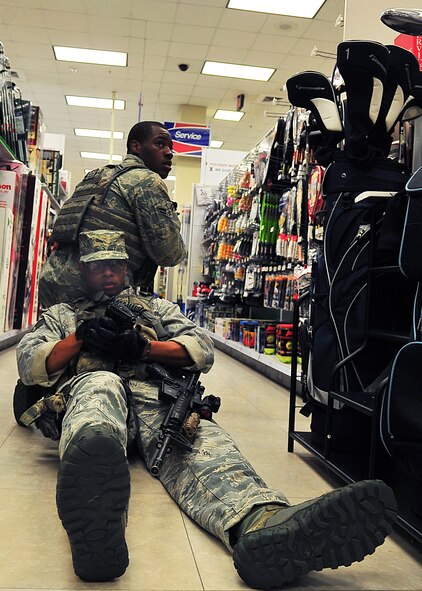Day four and five of the QRT training, August 12-13, rigorous physical training continued as obstacles increased with difficulty testing not only their strength but also their capabilities to act as a cohesive squad. Day four, SF Airmen were taught how to respond to an active shooter and/or hostage scenario in the Base Exchange and the base dormitories, as well as extraction of an active shooter in a vehicle. Day five SF Airmen performed combative training and practical exercises. Physical training sessions were themed in memory of the 31 warriors lost in Afghanistan, August 7, 2011, by each volunteer completing 31 of each exercise throughout the course. A QRT member provides immediate response to any high risk situation on Osan Air Base to include barricaded suspects, workplace violence, domestic violence and abuse response, school violence, and disaster response. (Photo by Staff Sgt. Daylena Gonzalez)  