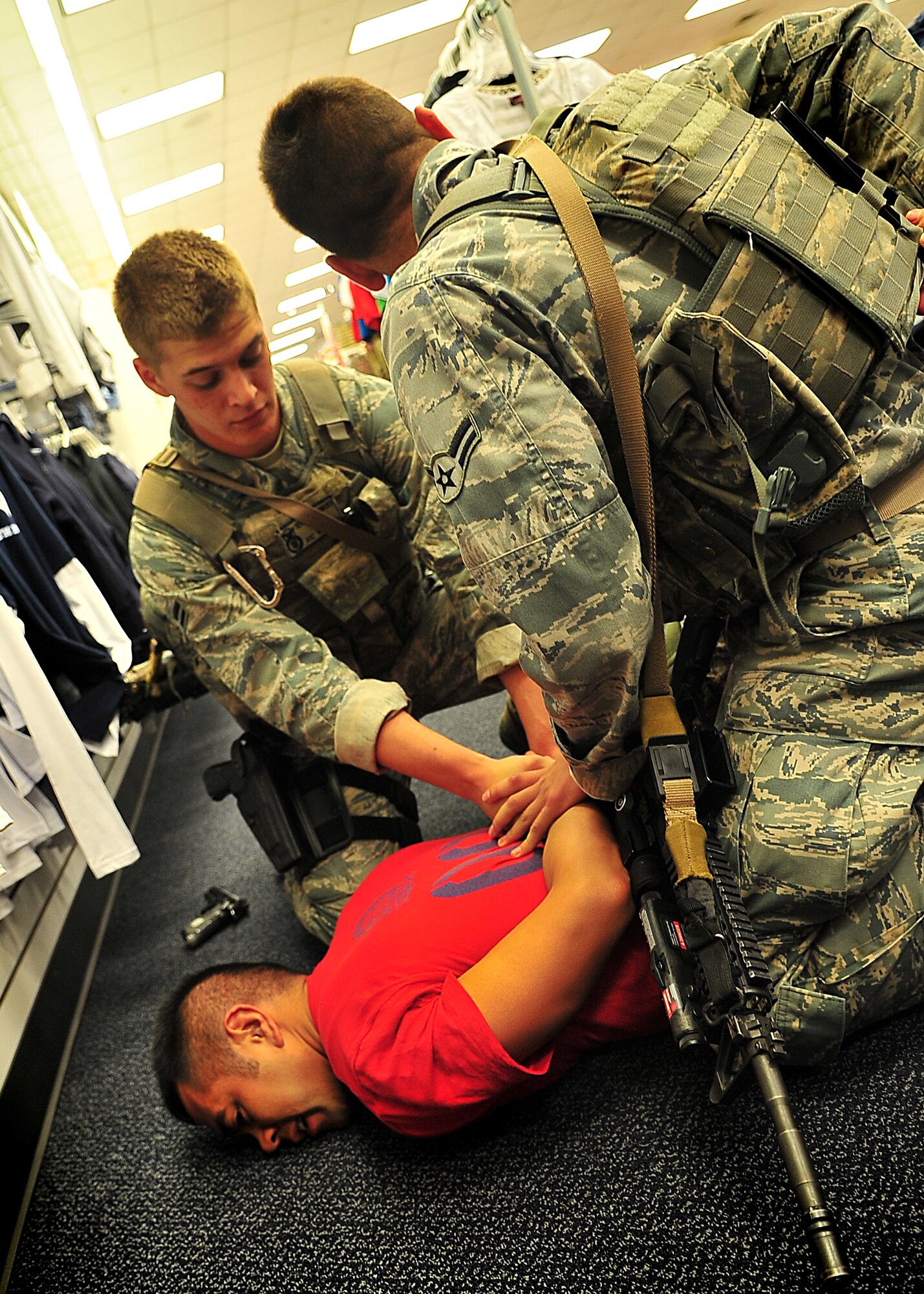 Day four and five of the QRT training, August 12-13, rigorous physical training continued as obstacles increased with difficulty testing not only their strength but also their capabilities to act as a cohesive squad. Day four, SF Airmen were taught how to respond to an active shooter and/or hostage scenario in the Base Exchange and the base dormitories, as well as extraction of an active shooter in a vehicle. Day five SF Airmen performed combative training and practical exercises. Physical training sessions were themed in memory of the 31 warriors lost in Afghanistan, August 7, 2011, by each volunteer completing 31 of each exercise throughout the course. A QRT member provides immediate response to any high risk situation on Osan Air Base to include barricaded suspects, workplace violence, domestic violence and abuse response, school violence, and disaster response. (Photo by Staff Sgt. Daylena Gonzalez)  