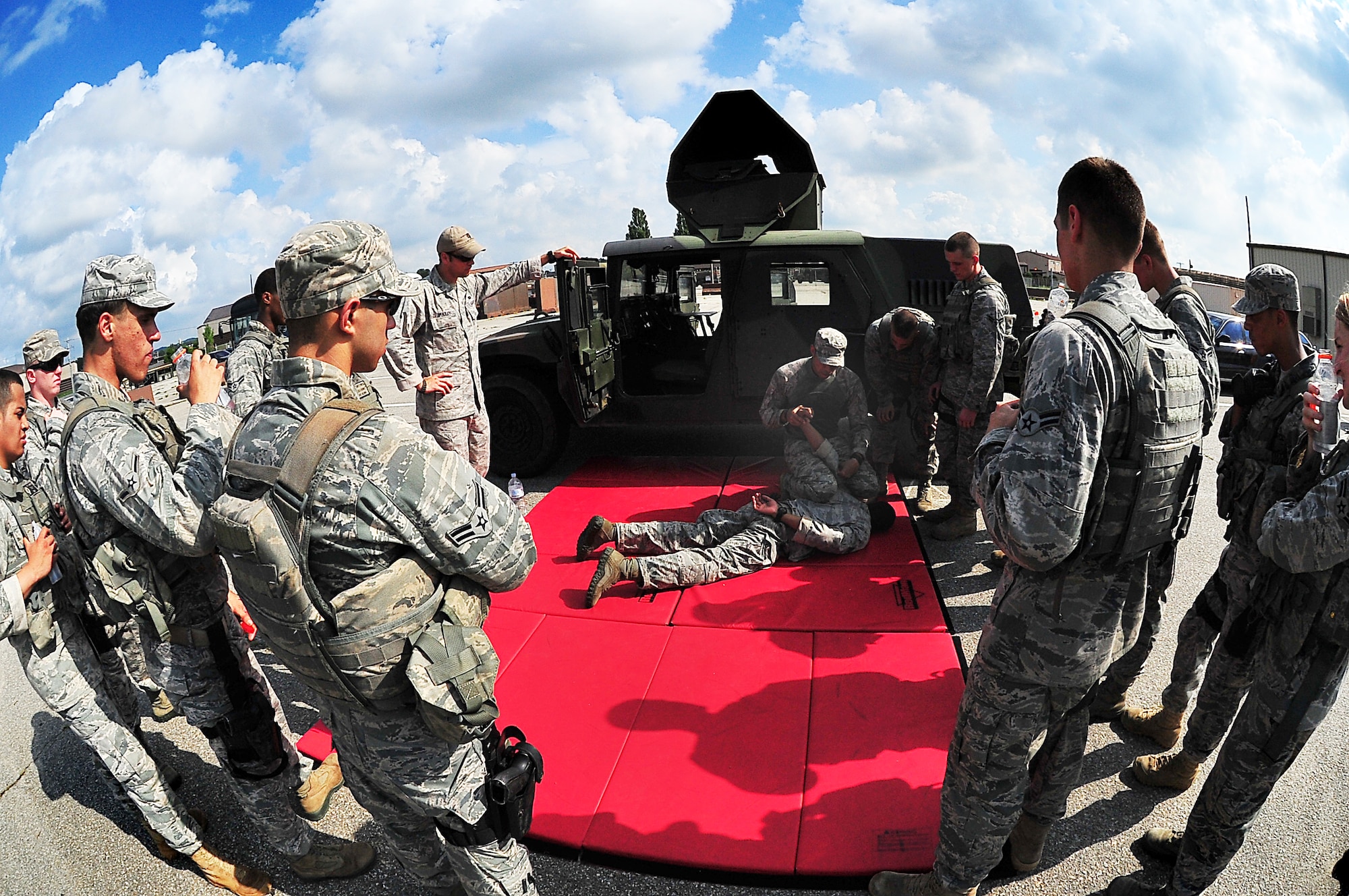 Day four and five of the QRT training, August 12-13, rigorous physical training continued as obstacles increased with difficulty testing not only their strength but also their capabilities to act as a cohesive squad. Day four, SF Airmen were taught how to respond to an active shooter and/or hostage scenario in the Base Exchange and the base dormitories, as well as extraction of an active shooter in a vehicle. Day five SF Airmen performed combative training and practical exercises. Physical training sessions were themed in memory of the 31 warriors lost in Afghanistan, August 7, 2011, by each volunteer completing 31 of each exercise throughout the course. A QRT member provides immediate response to any high risk situation on Osan Air Base to include barricaded suspects, workplace violence, domestic violence and abuse response, school violence, and disaster response. (Photo by Staff Sgt. Daylena Gonzalez)  