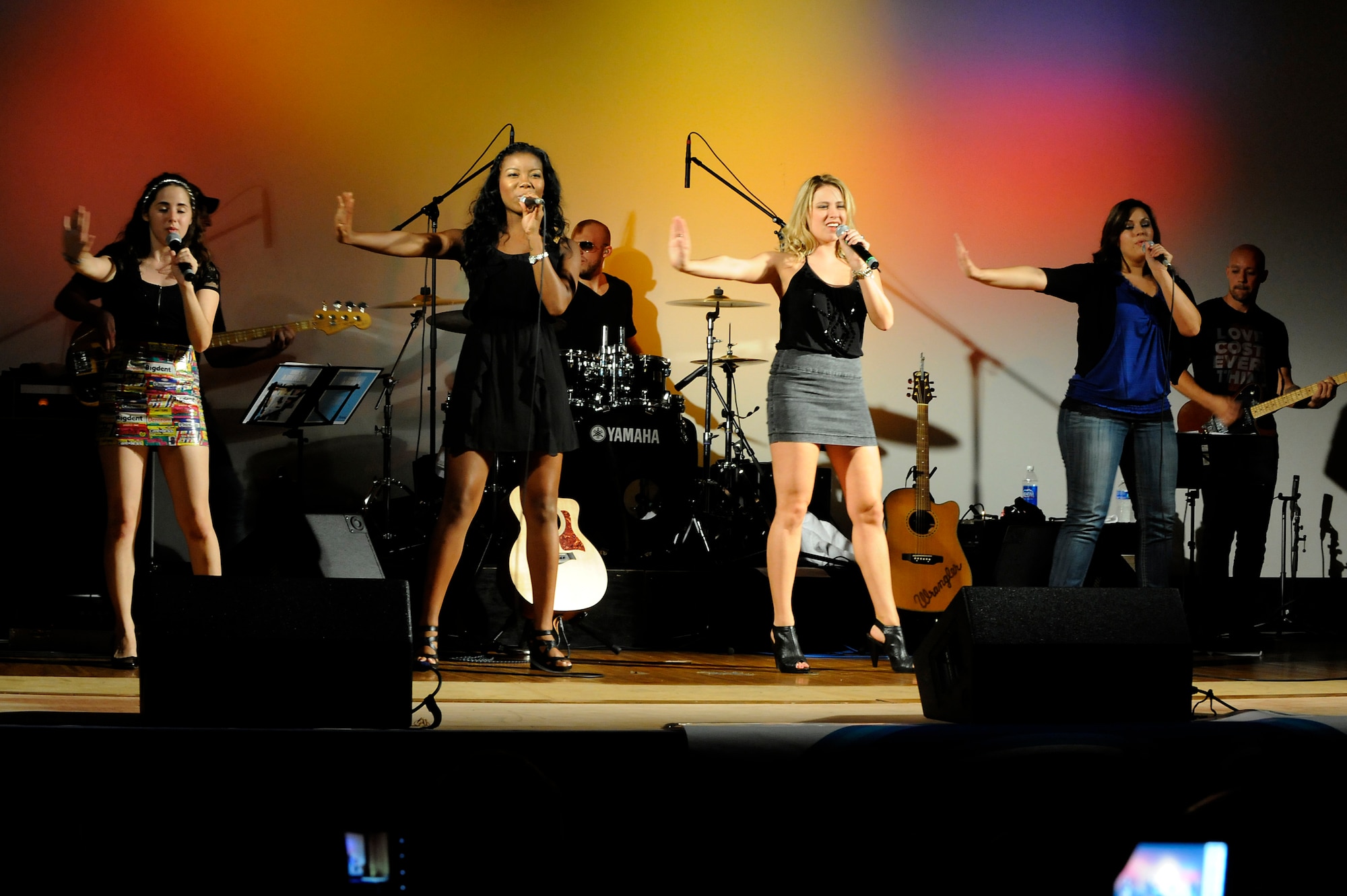MISAWA AIR BASE, Japan -- The women of American Idol sing together during a live concert at the Richard Bong Training Facility Aug. 12. Members of American Idol visited Misawa as part of an Armed Forces Entertainment show to support military members and their families. (U.S. Air Force photo/Tech. Sgt. Marie Brown)