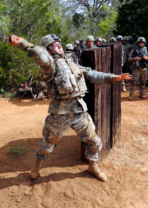 An Army soldier launches a dummy grenade at Camp Swift in Bastrop, Texas, Aug. 13, 2011.
