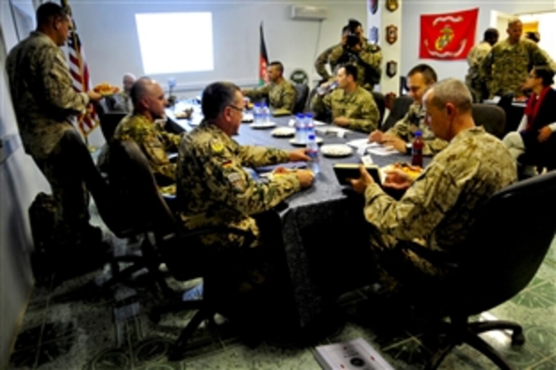 U.S. Marine Corps Gen. John R. Allen, commander of U.S. and international forces in Afghanistan, visits with commanders assigned to Regional Command West units and distinguished guests in Farah province, Afghanistan, Aug. 11, 2011. The guests included members of Provincial Reconstruction Team Farah and Forward Operating Base Farah.