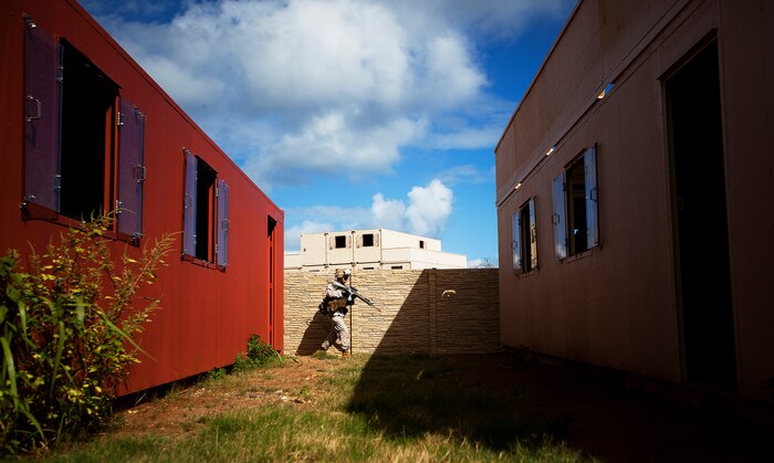 Lance Cpl. John Corsi, a rifleman with India Company, 3rd Battalion, 3rd Marine Regiment, moves toward his squad’s next objective during counterinsurgency training on Marine Corps Base Hawaii, Aug. 15, 2011. The infantry Marines are preparing for the Mojave Viper exercise at Marine Corps Air Ground Combat Center Twentynine Palms, Calif., at the end of August, following pre-deployment training on the Island of Hawaii and here. This month long training event will be 3/3’s final evaluation before deploying to Afghanistan’s Helmand province in support of Operation Enduring Freedom this fall. Corsi, 22, is from Jupiter Farms, Fla.