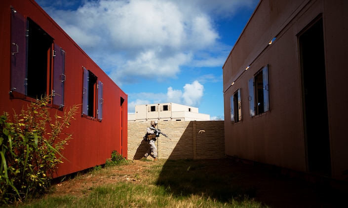 Lance Cpl. John Corsi, a rifleman with India Company, 3rd Battalion, 3rd Marine Regiment, moves toward his squad’s next objective during counterinsurgency training on Marine Corps Base Hawaii, Aug. 15, 2011. The infantry Marines are preparing for the Mojave Viper exercise at Marine Corps Air Ground Combat Center Twentynine Palms, Calif., at the end of August, following pre-deployment training on the Island of Hawaii and here. This month long training event will be 3/3’s final evaluation before deploying to Afghanistan’s Helmand province in support of Operation Enduring Freedom this fall. Corsi, 22, is from Jupiter Farms, Fla.