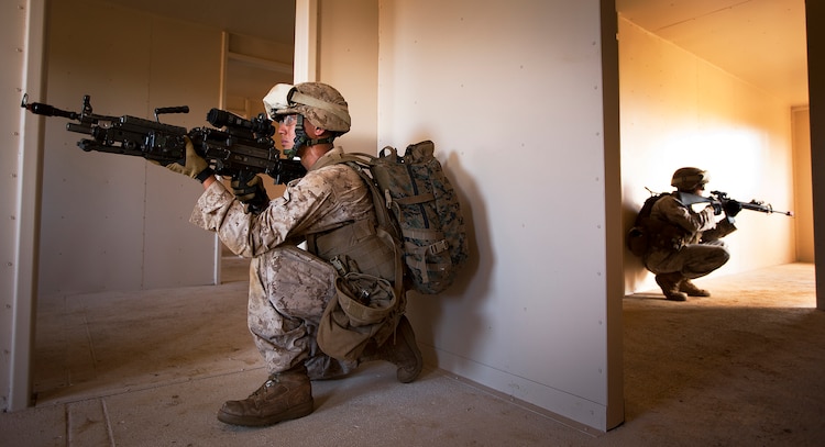 Lance Cpl. Martin Argueta, a rifleman with India Company, 3rd Battalion, 3rd Marine Regiment, posts security while his squad clears a house during counterinsurgency training on Marine Corps Base Hawaii, Aug. 15, 2011. The infantry Marines are preparing for the Mojave Viper exercise at Marine Corps Air Ground Combat Center Twentynine Palms, Calif., at the end of August, following pre-deployment training on the Island of Hawaii and here. This month long training event will be 3/3’s final evaluation before deploying to Afghanistan’s Helmand province in support of Operation Enduring Freedom this fall. Argueta, 19, is from Yuma, Ariz.