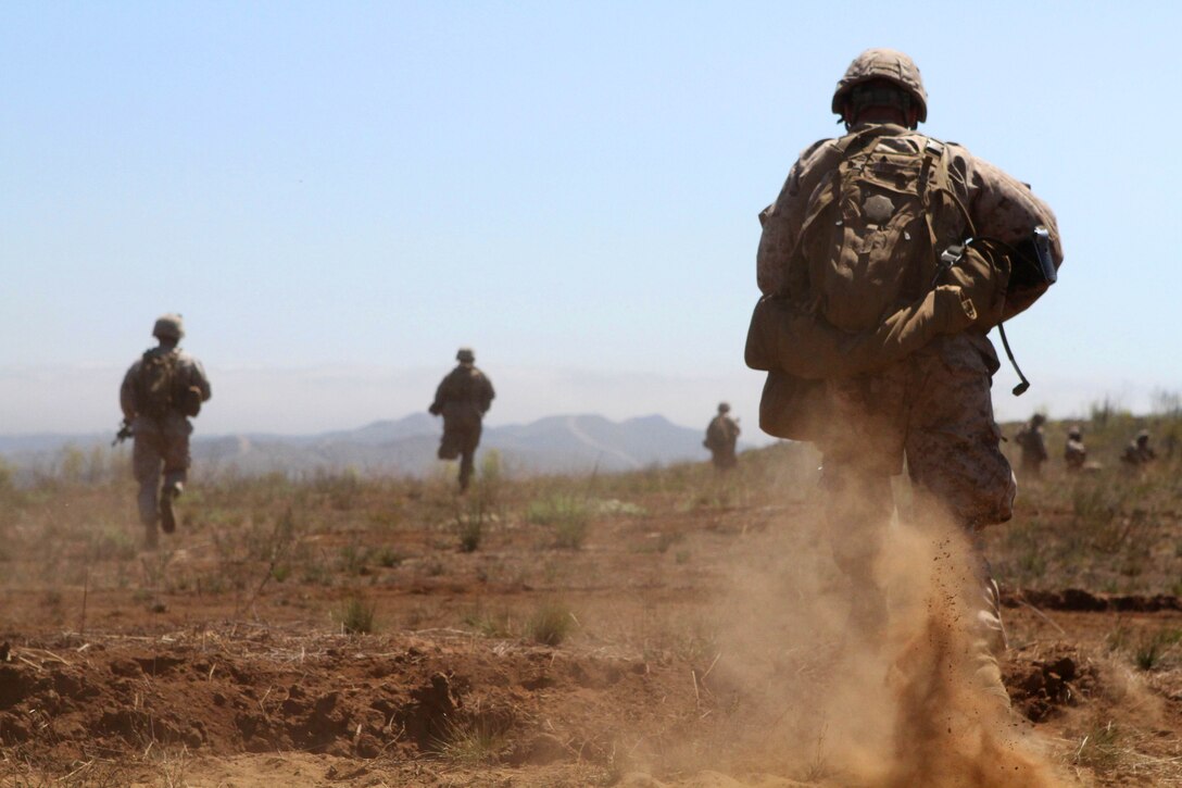 Marines rehearse rushing an enemy position Aug. 15 during a live-fire exercise here with Company L, one of three rifle companies in Battalion Landing Team 3/1, the ground combat element for the 11th Marine Expeditionary Unit. Company L spent five days in the field during the unit’s first sea-based training since becoming a complete Marine air ground task force in May. The company disembarked USS New Orleans off Pendleton’s coast and was driven ashore by amphibious assault vehicles. A platoon of tracked vehicles from 3rd Assault Amphibian Battalion, Camp Pendleton, reinforces the Pendleton-based 3rd Battalion, 1st Marines. The platoon provides the go-to means of maneuver for Company L.