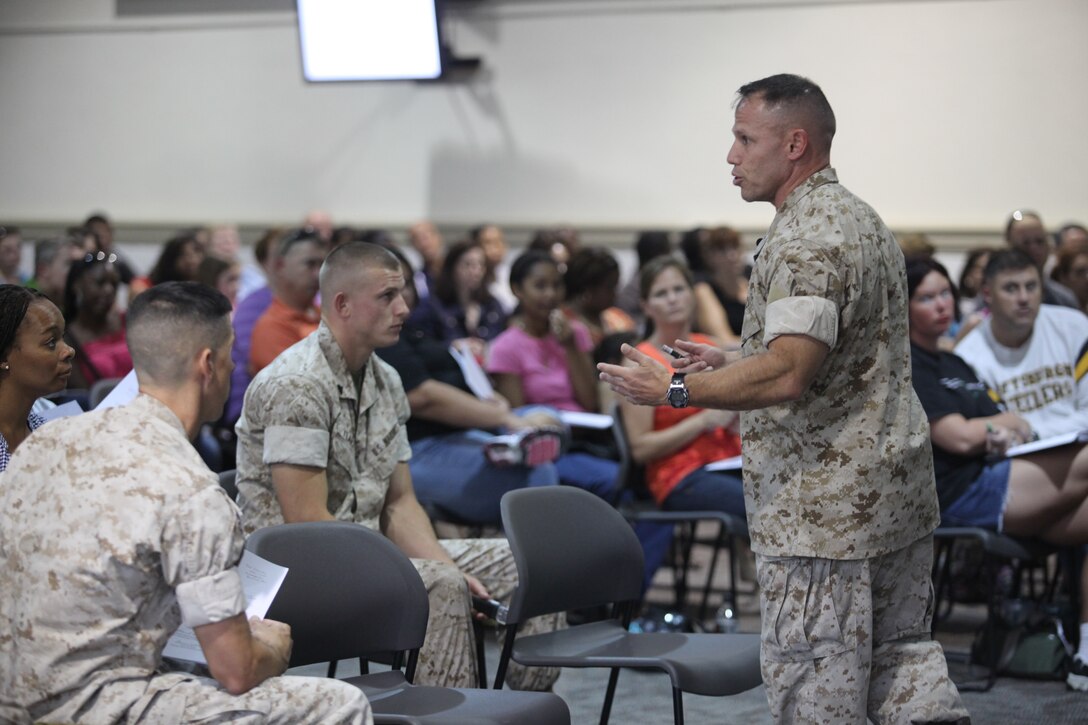 Col. Daniel Lecce, commanding officer of Marine Corps Base Camp Lejeune, addresses parents of Heroes Elementary School children during a town hall meeting held at the Russell Marine and Family Services Center Aug. 16. During the meeting, Lecce went over North Carolina district leadership, timelines, construction status, elementary school staff and enrollment numbers as well as the welcome back letter to all Heroes students.