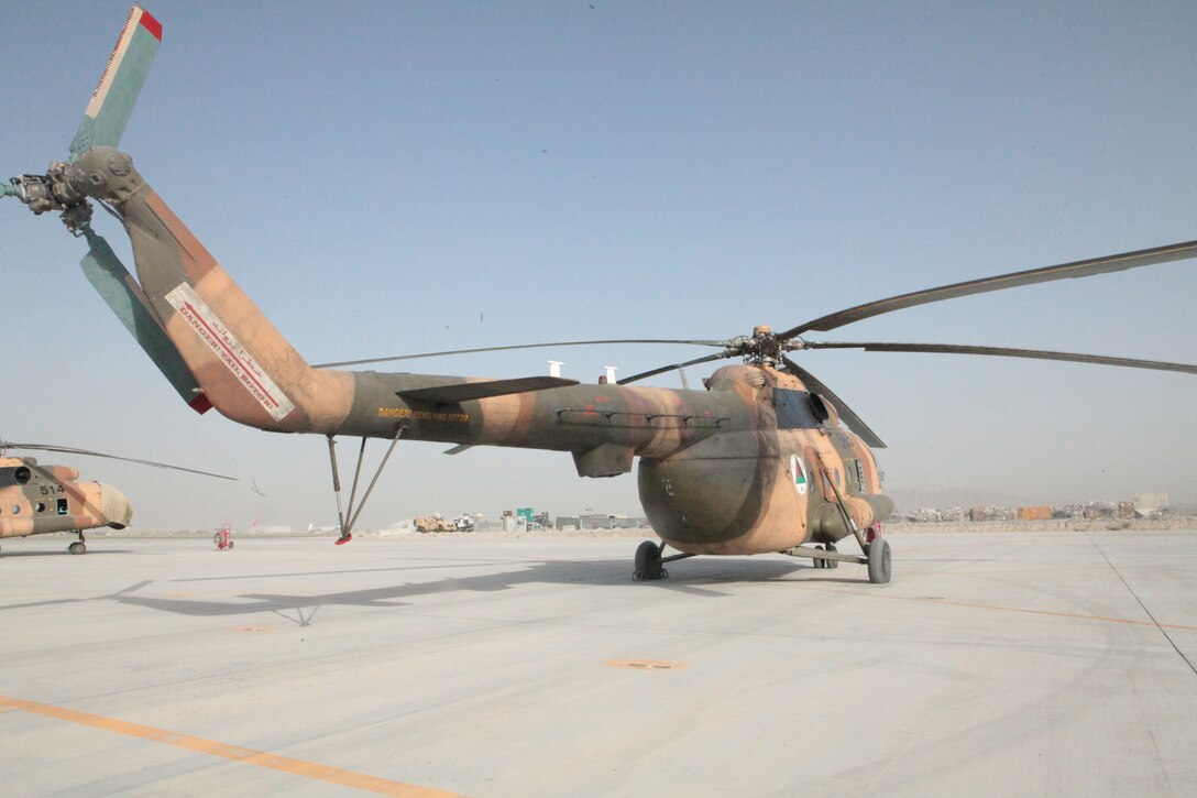An Afghan National Army Air Force Mi-17 helicopter rests on the runway at Kandahar Airfield, Afghanistan. The Afghan National Army's Air Force recently completed its first unassisted helicopter-borne medical evacuation, flying a stabilized patient from Camp Shorabak in Helmand province to Kandahar Airfield.